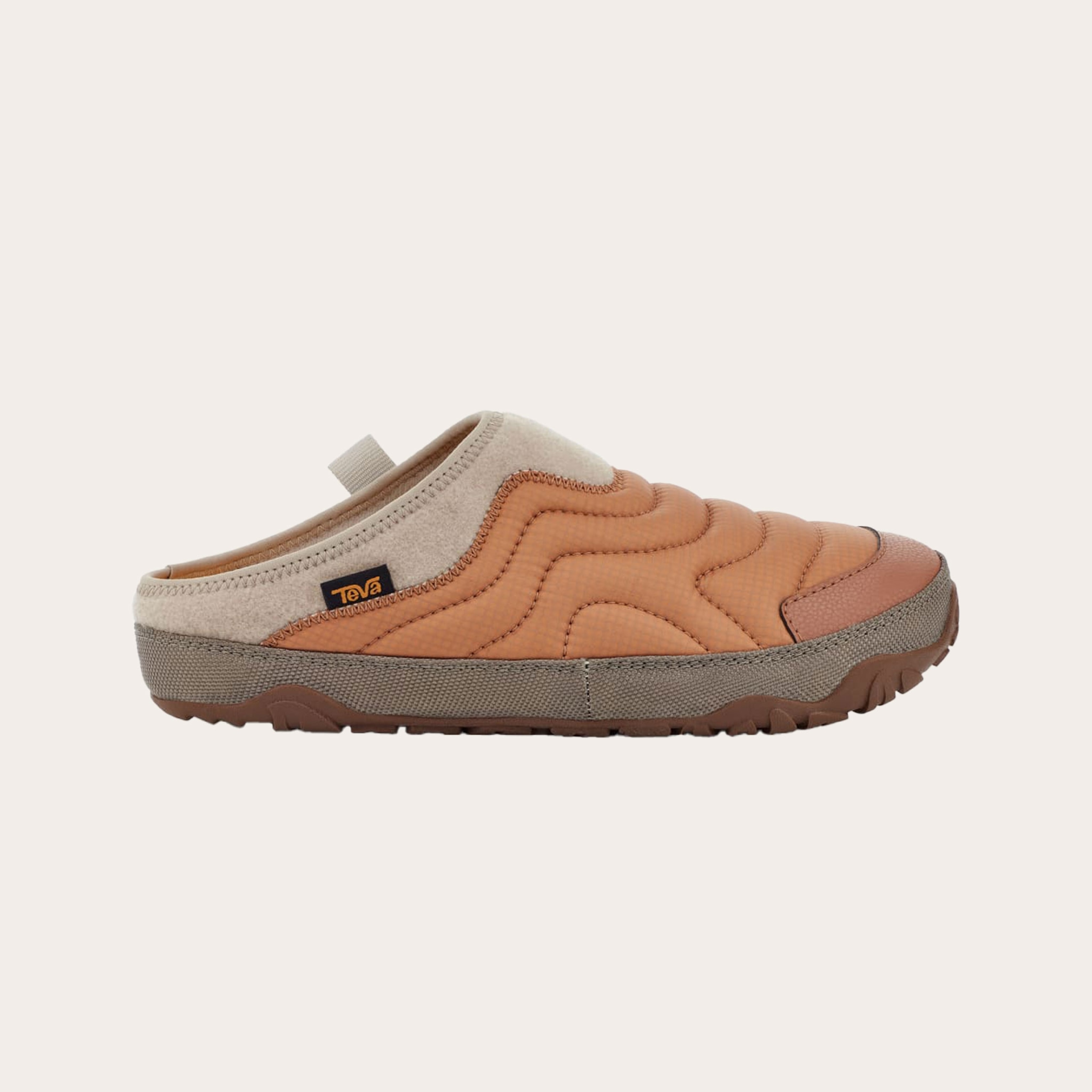 Orange and tan slipper placed on a tan background.