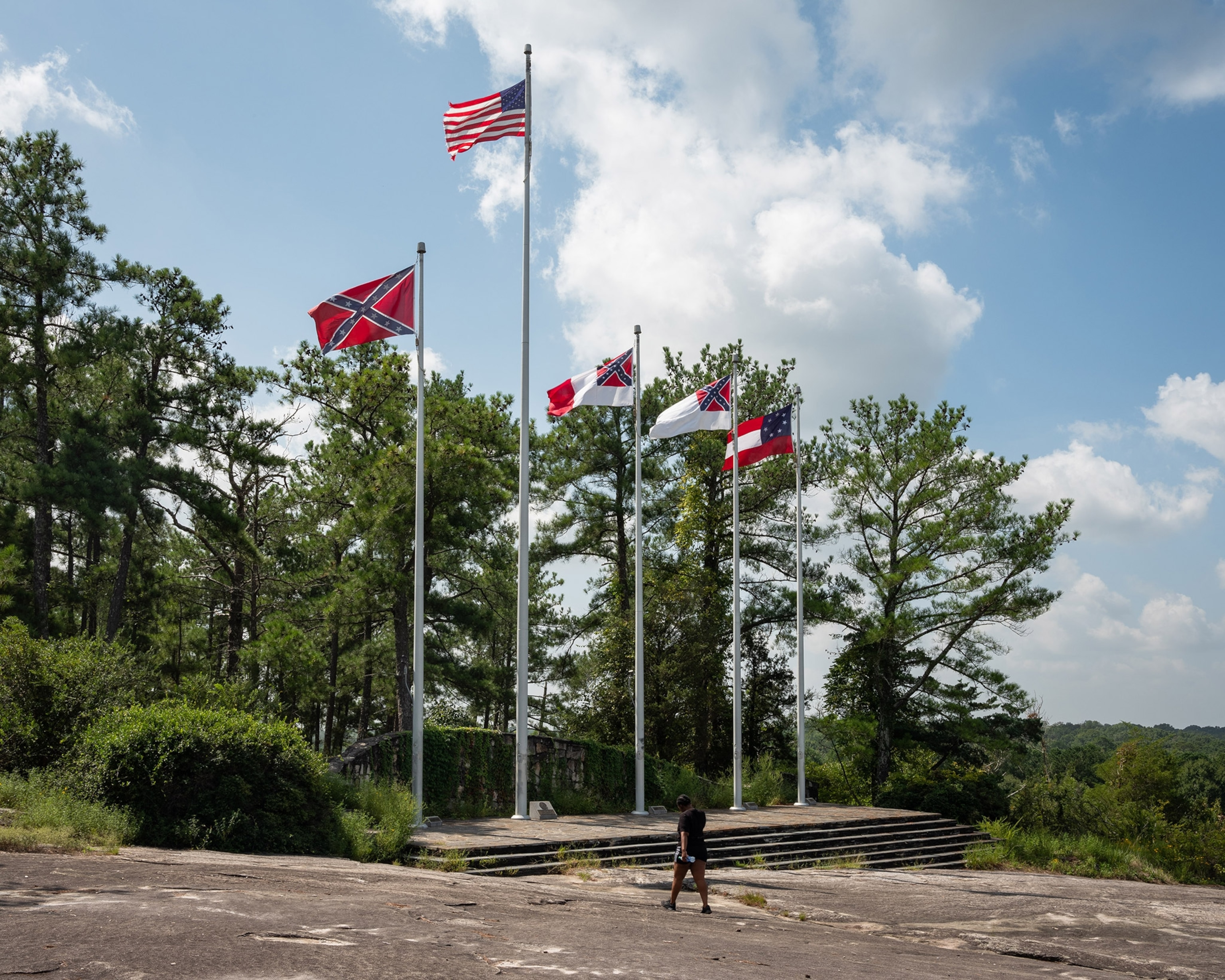 a terrace with Confederate flags at the base of Stone Mountain in Georgia