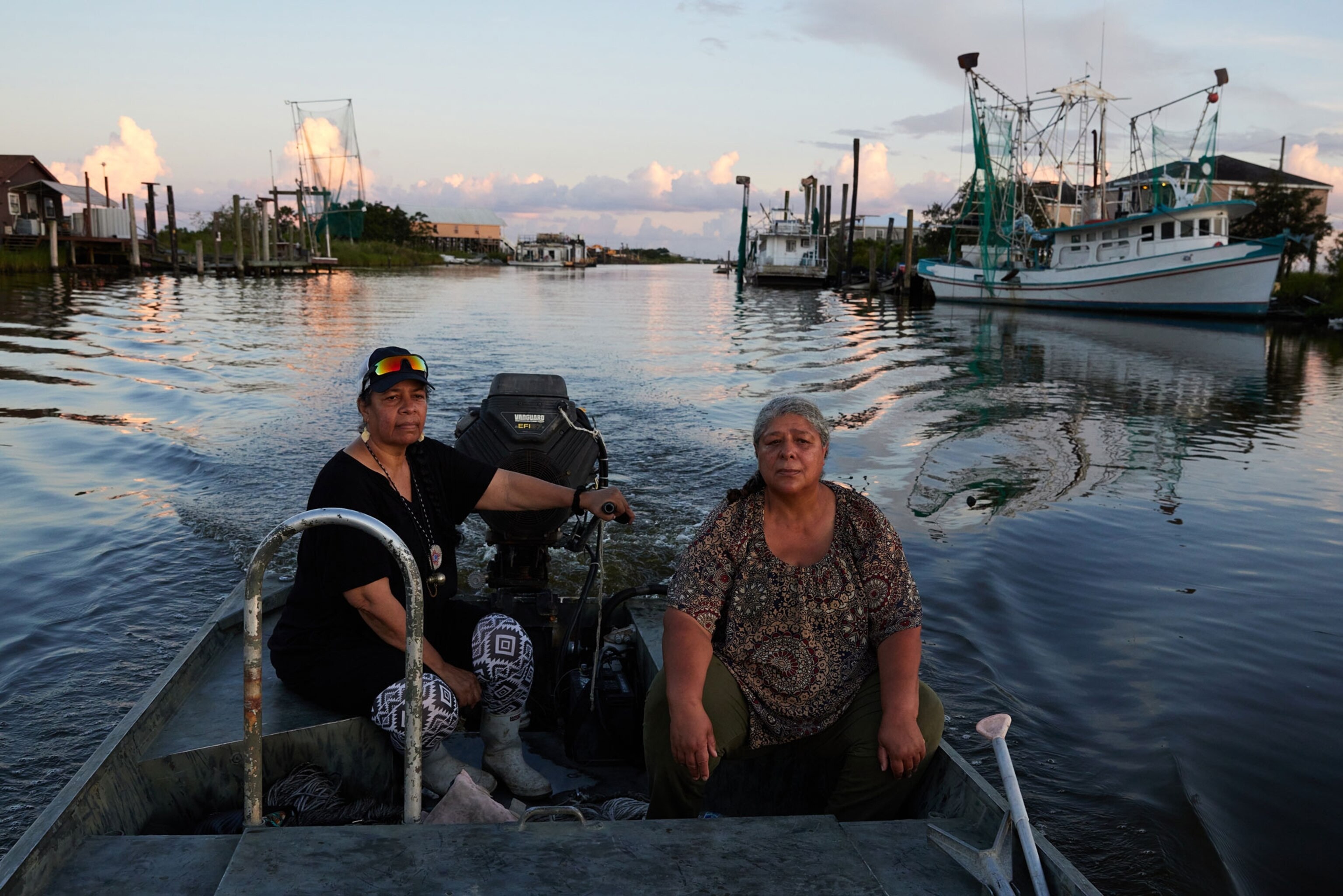 Rosina Philippe, and Carmalita Sylve,of the Atakapa-Ishak/Chawasha Tribe, pass through their Grand Bayou community on a boat