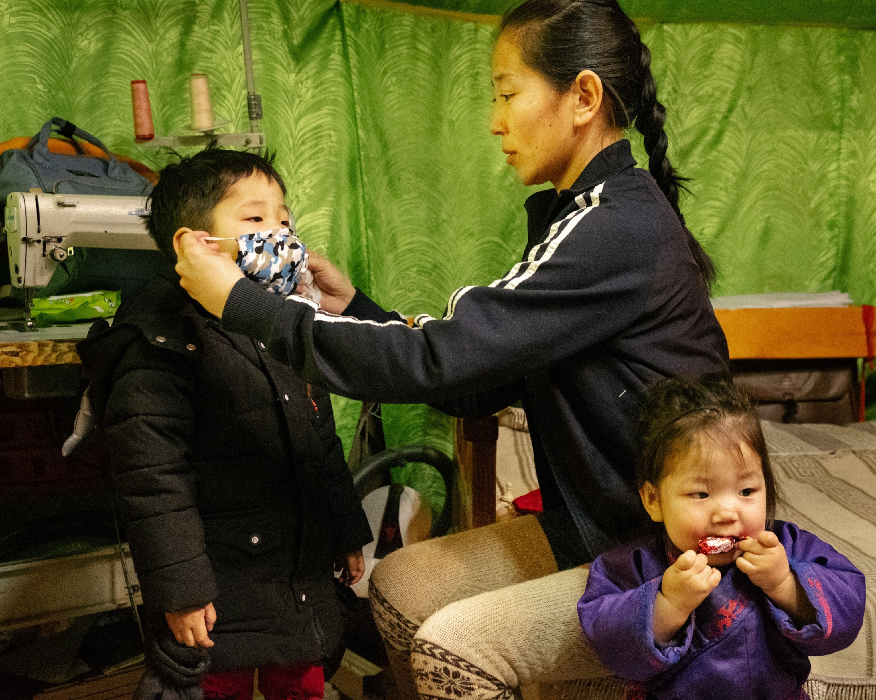 a family putting on masks