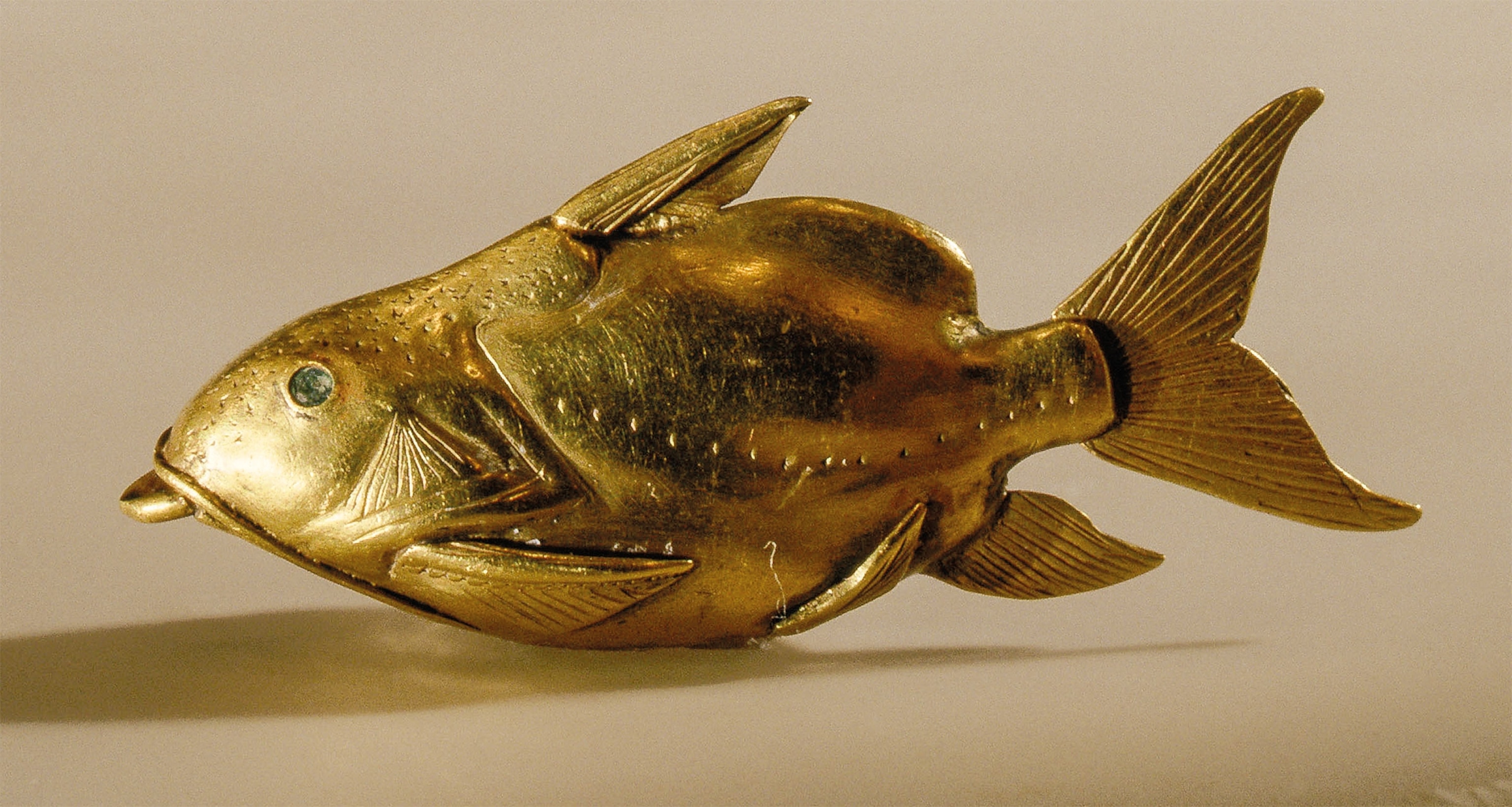 This circa 1878-1749 B.C. golden pendant depicting an upside-down catfish is housed at the Royal Museum of Scotland in Edinburgh.