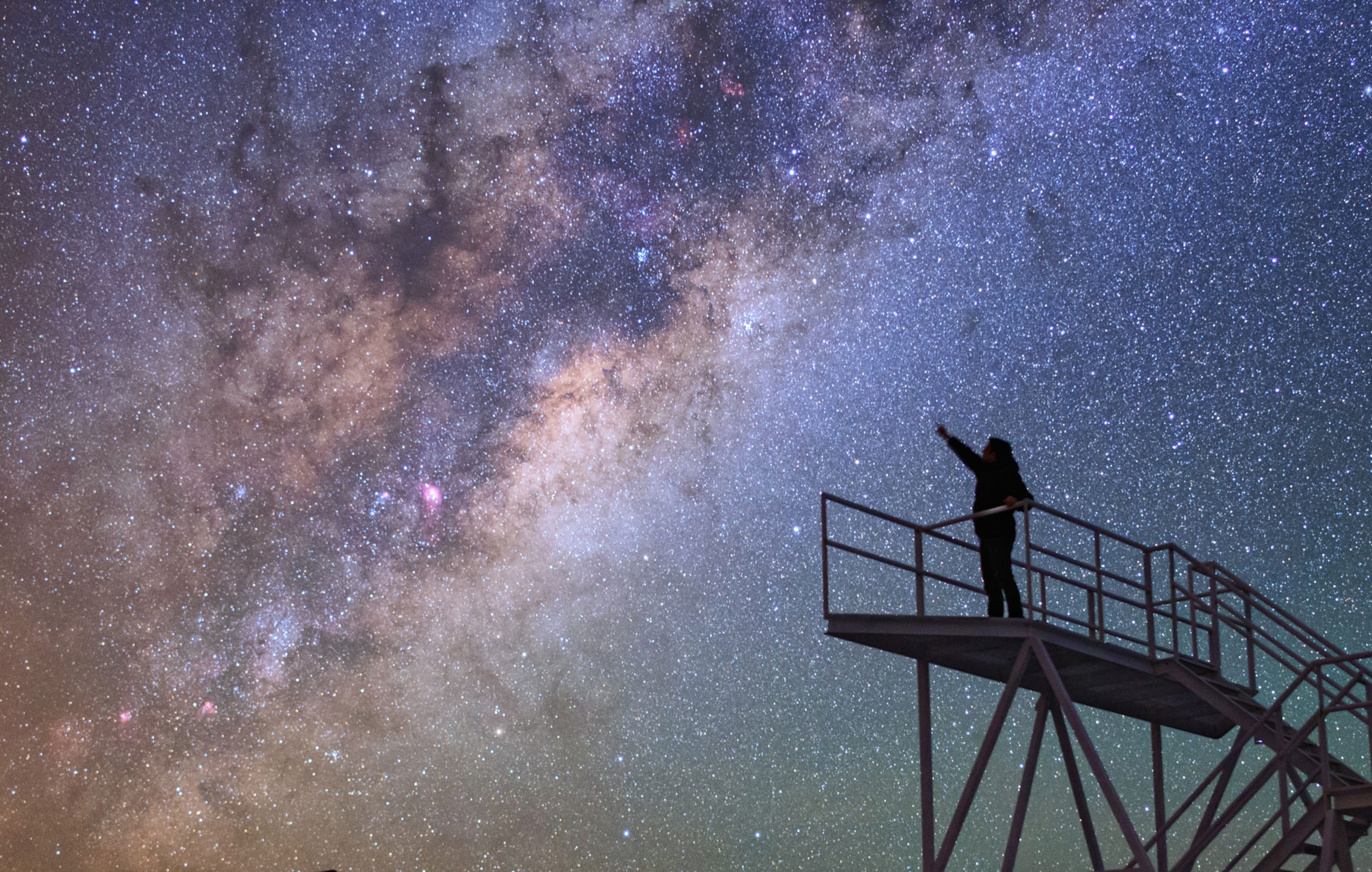 A stargazer points at the constellations