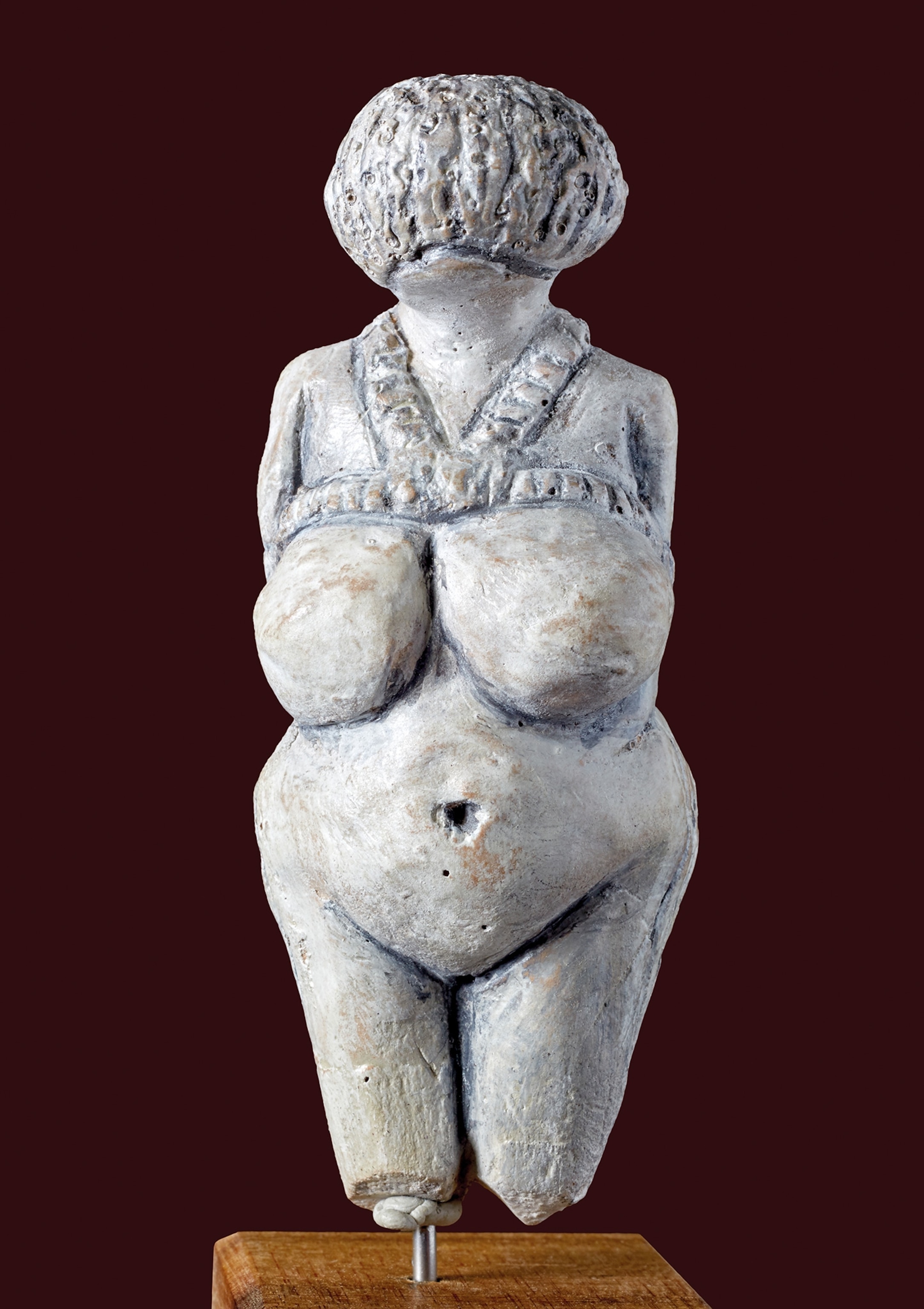 The front of a limestone figurine Venus is pictured.