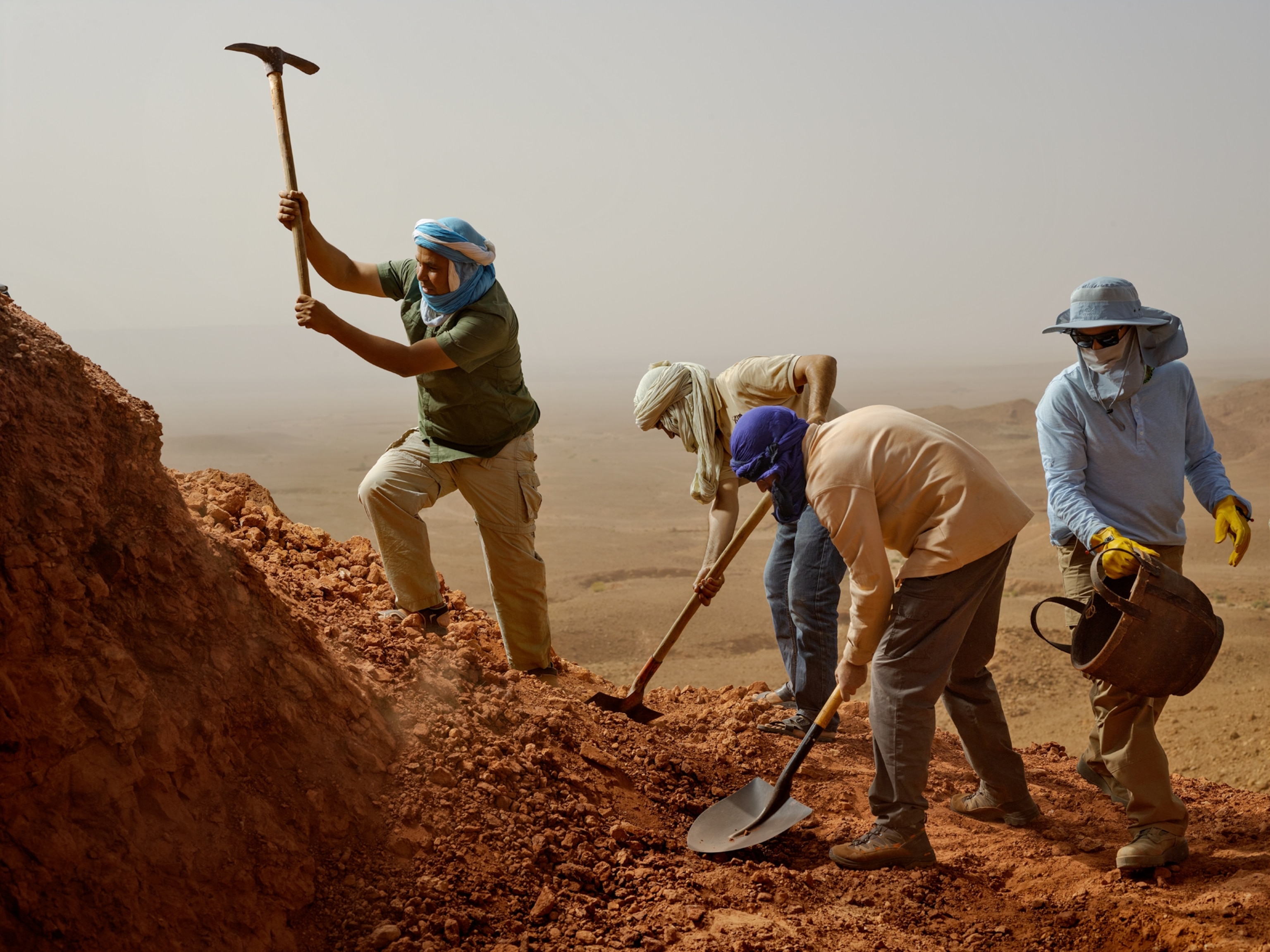men digging in a desert