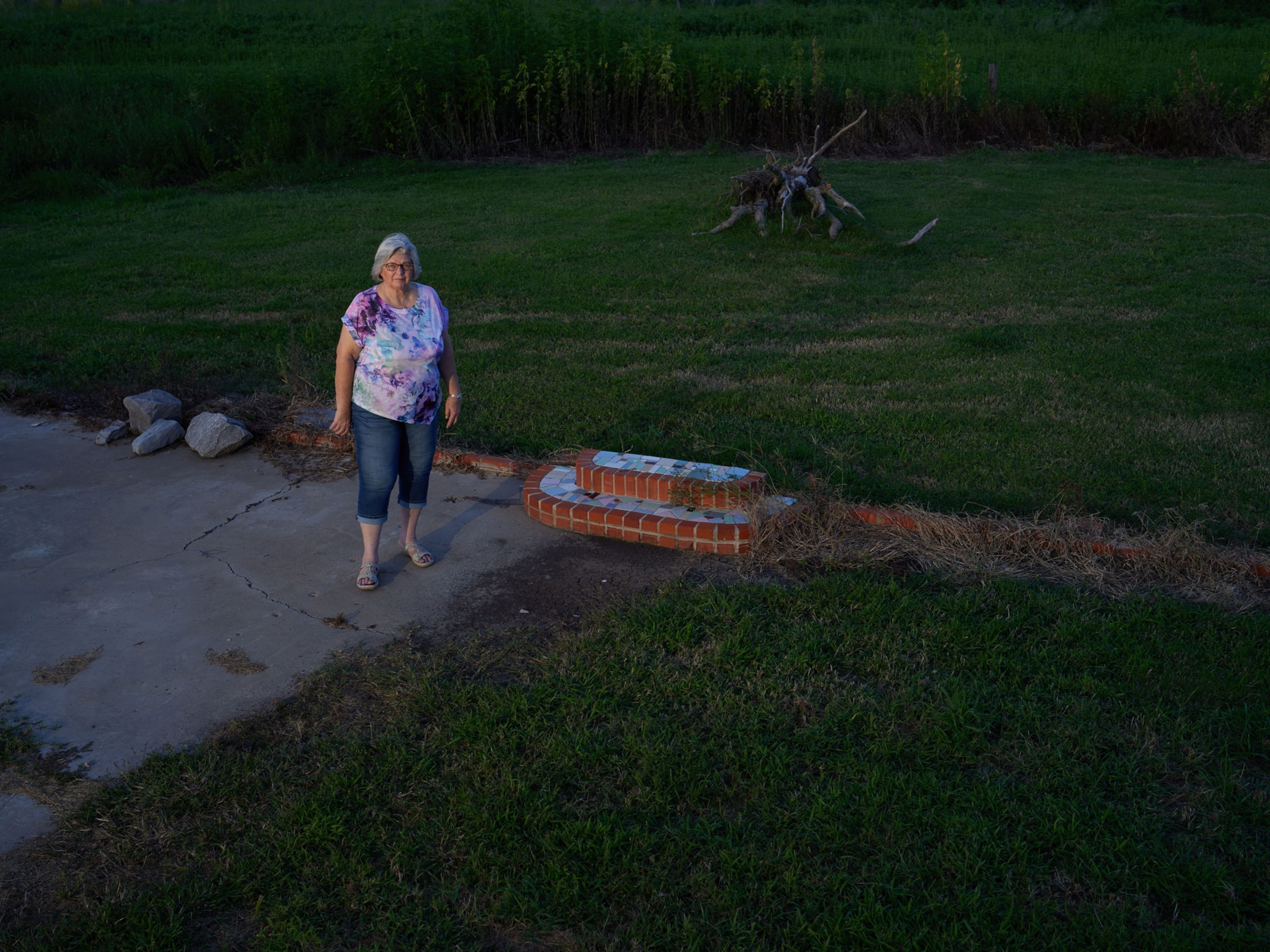 Cyndi Sellers near the site of her childhood home that was destroyed by a hurricane