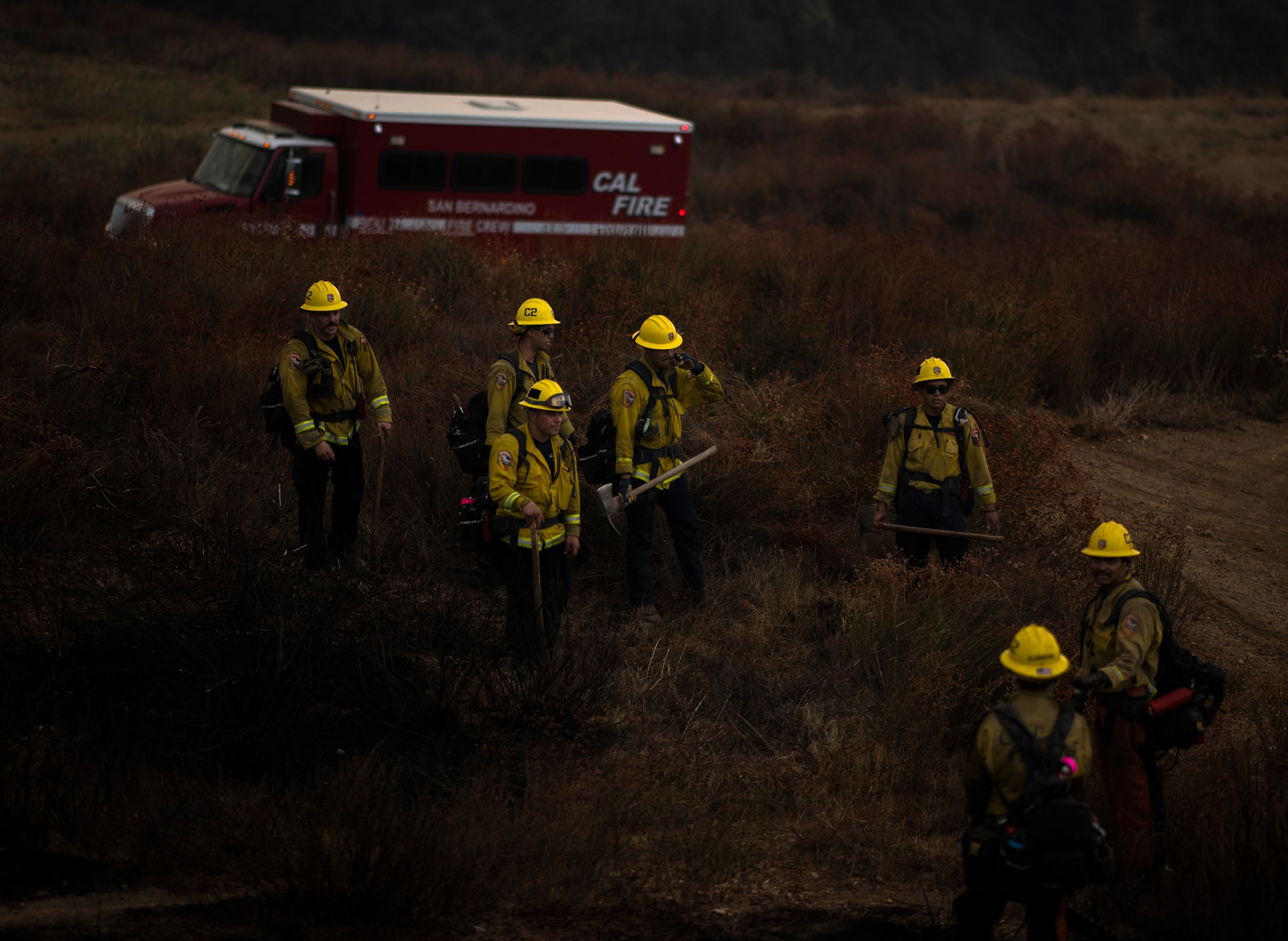 smokey and ash covered cal fire crew