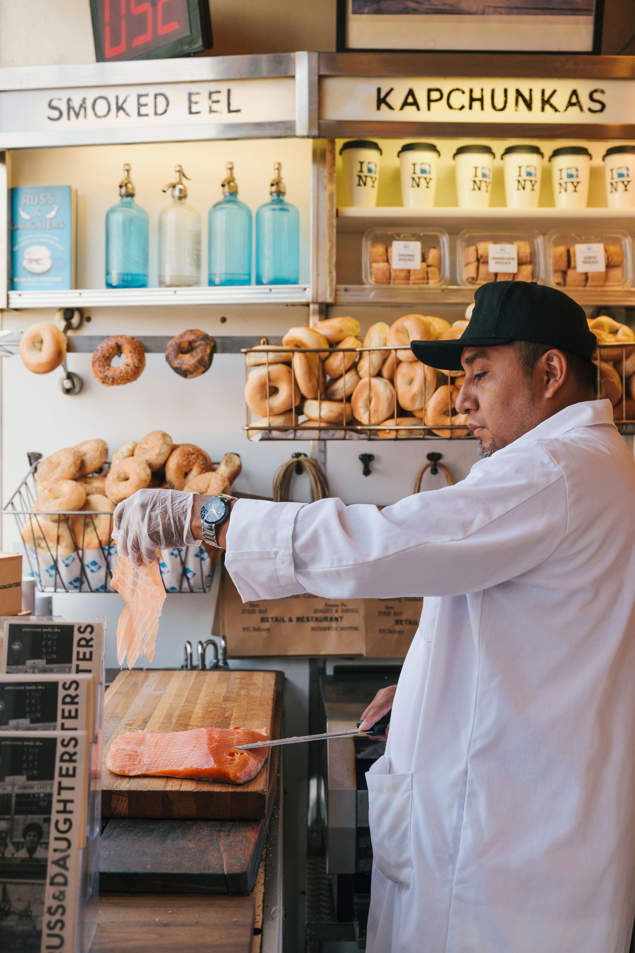 chef slicing salmon within restaurant