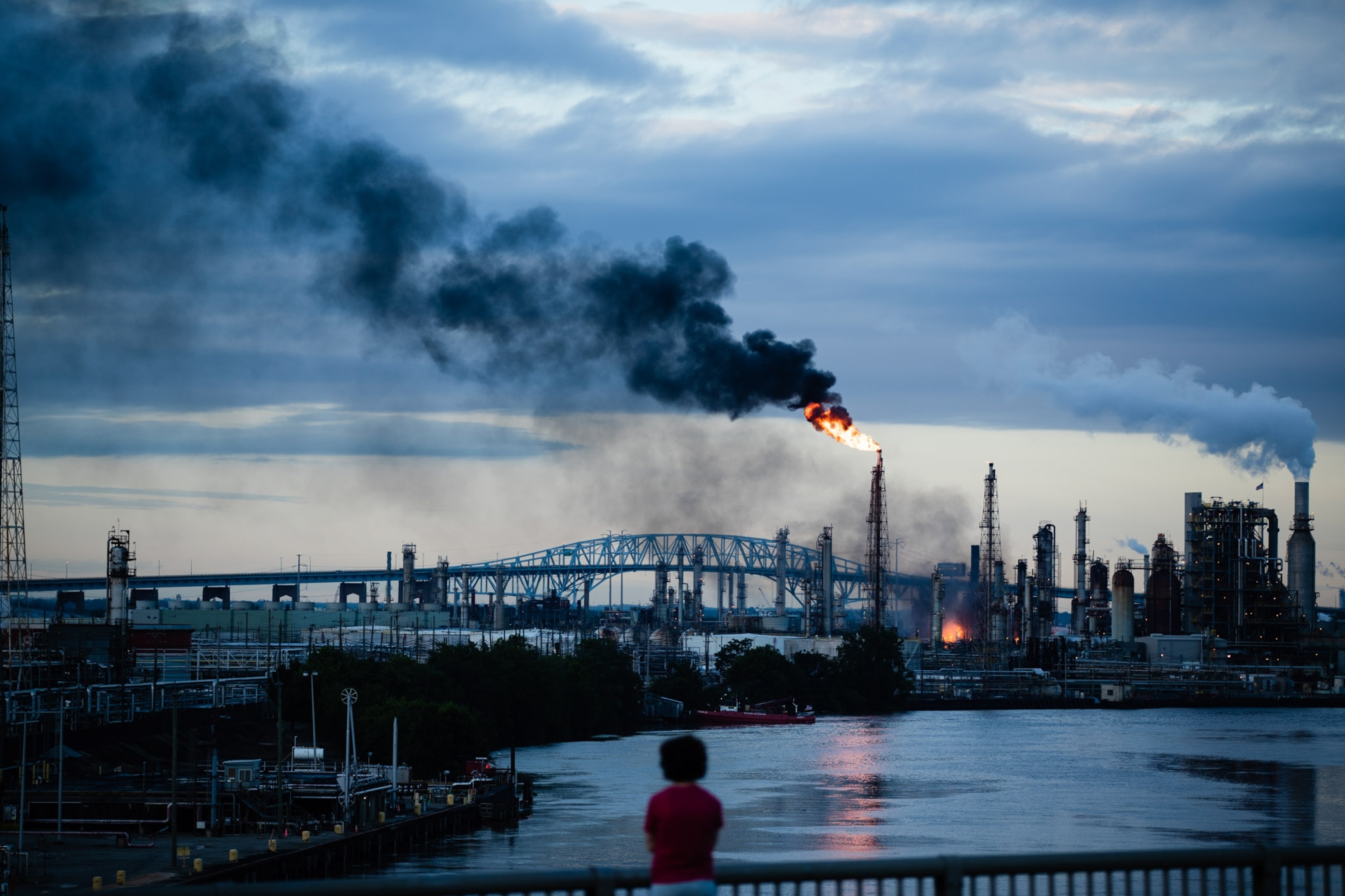Dark smoke billows from a fire.
