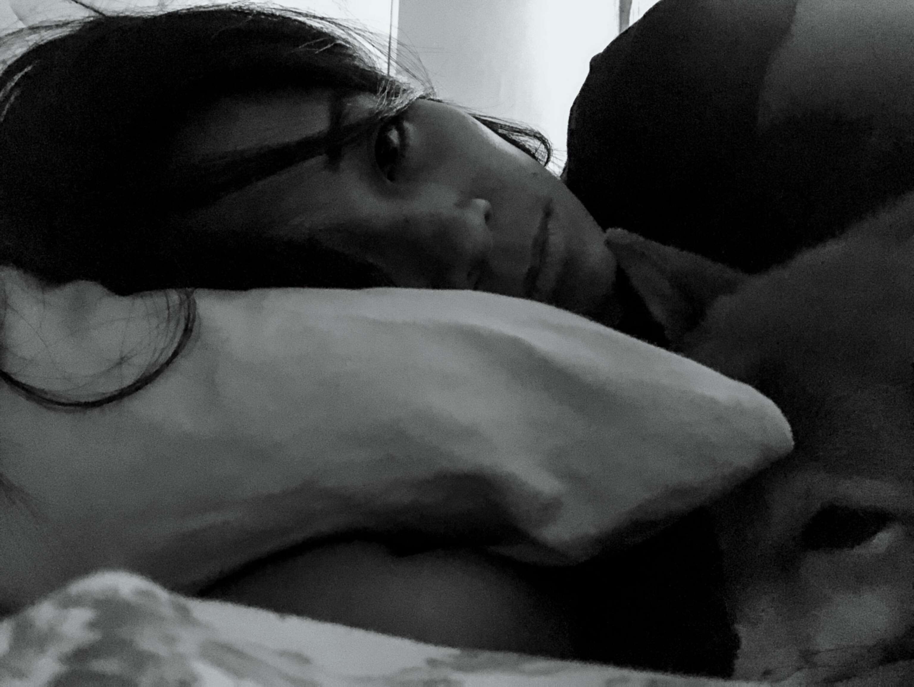 a woman laying in bed