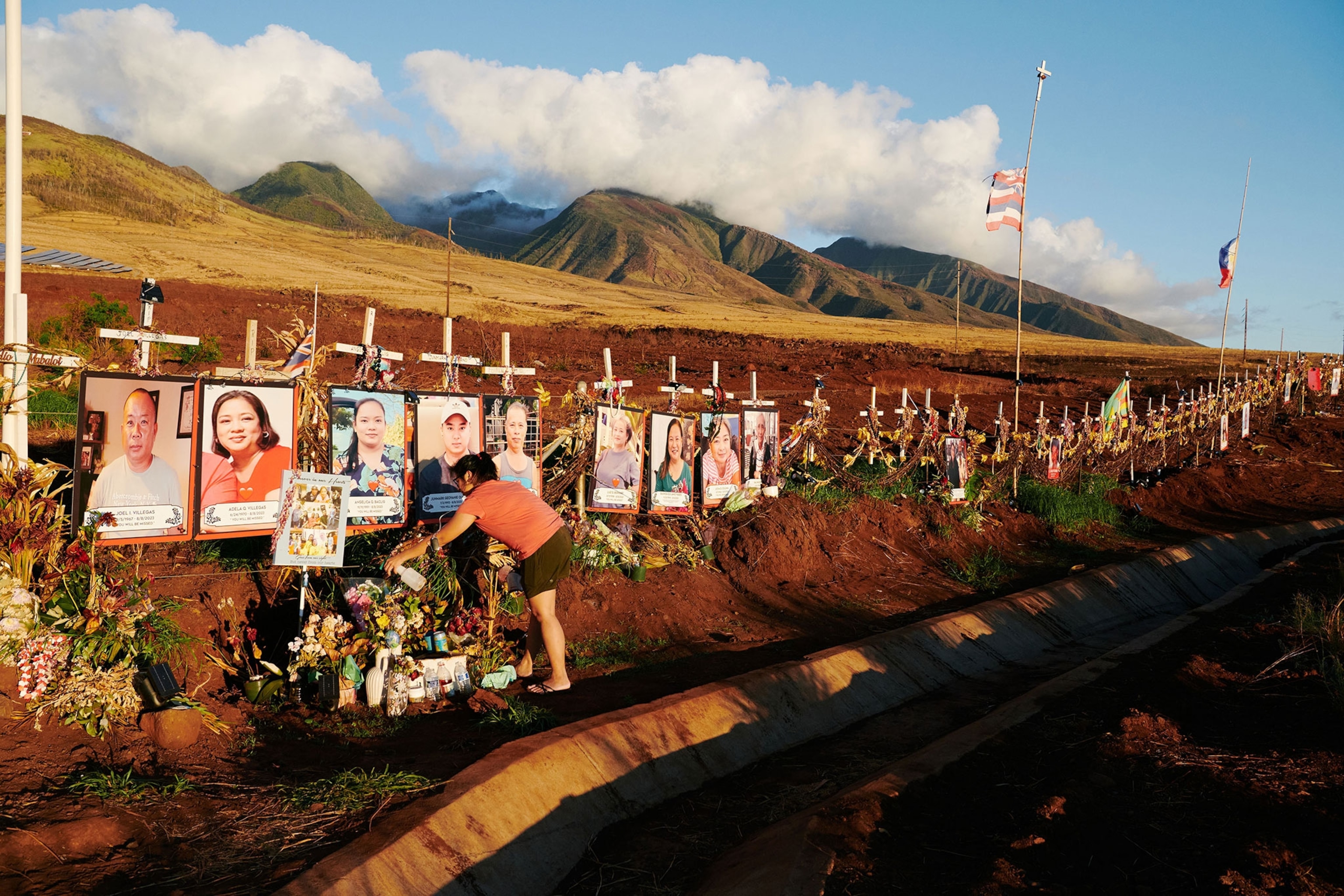 Friends of the Coloma-Villegas-Quijano Family visit the memorial of their friend who passed in the fire.