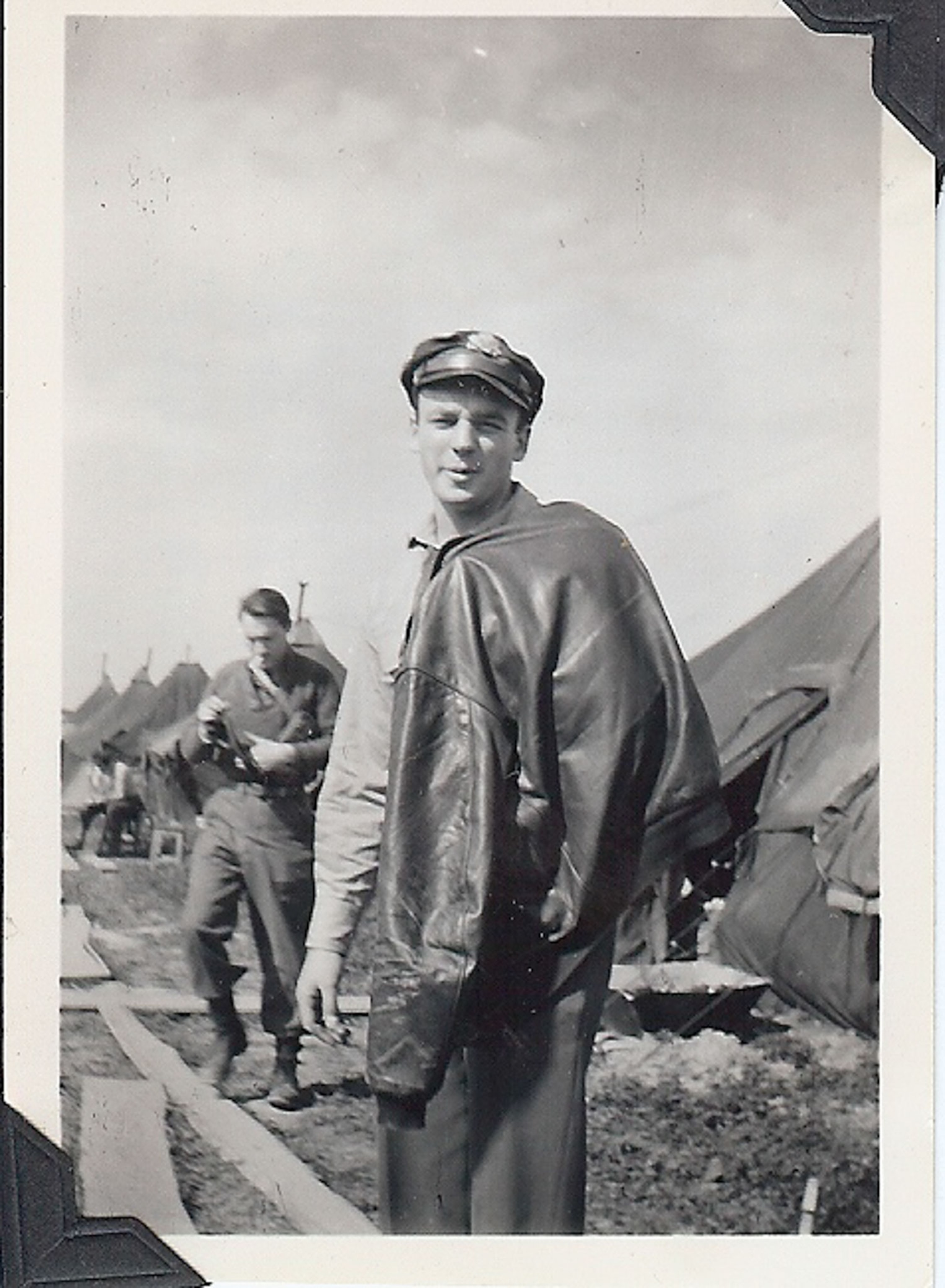 a black and white photo of a male soldier during World War II