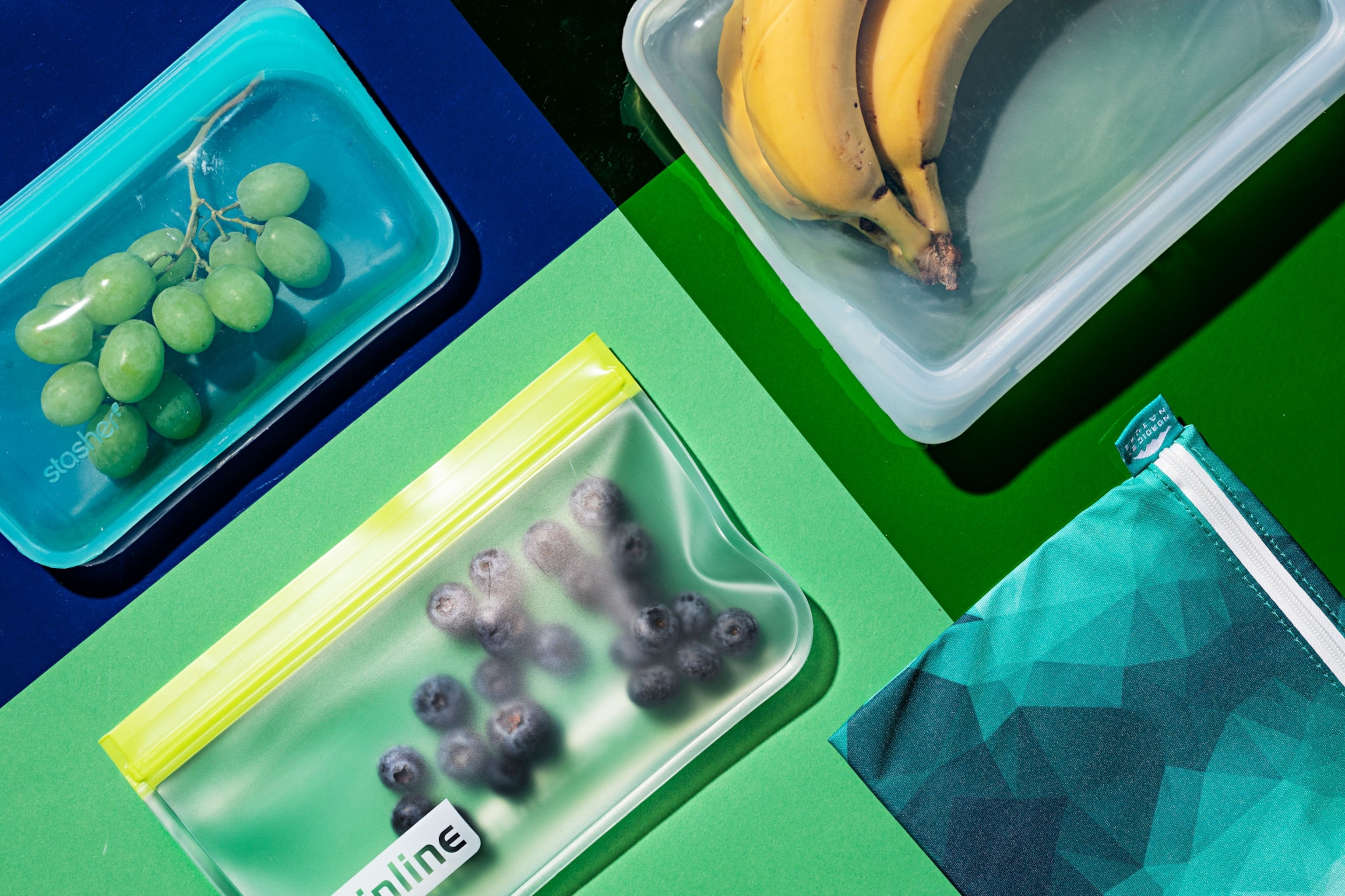 Fruit is held inside reusable plastic bags.