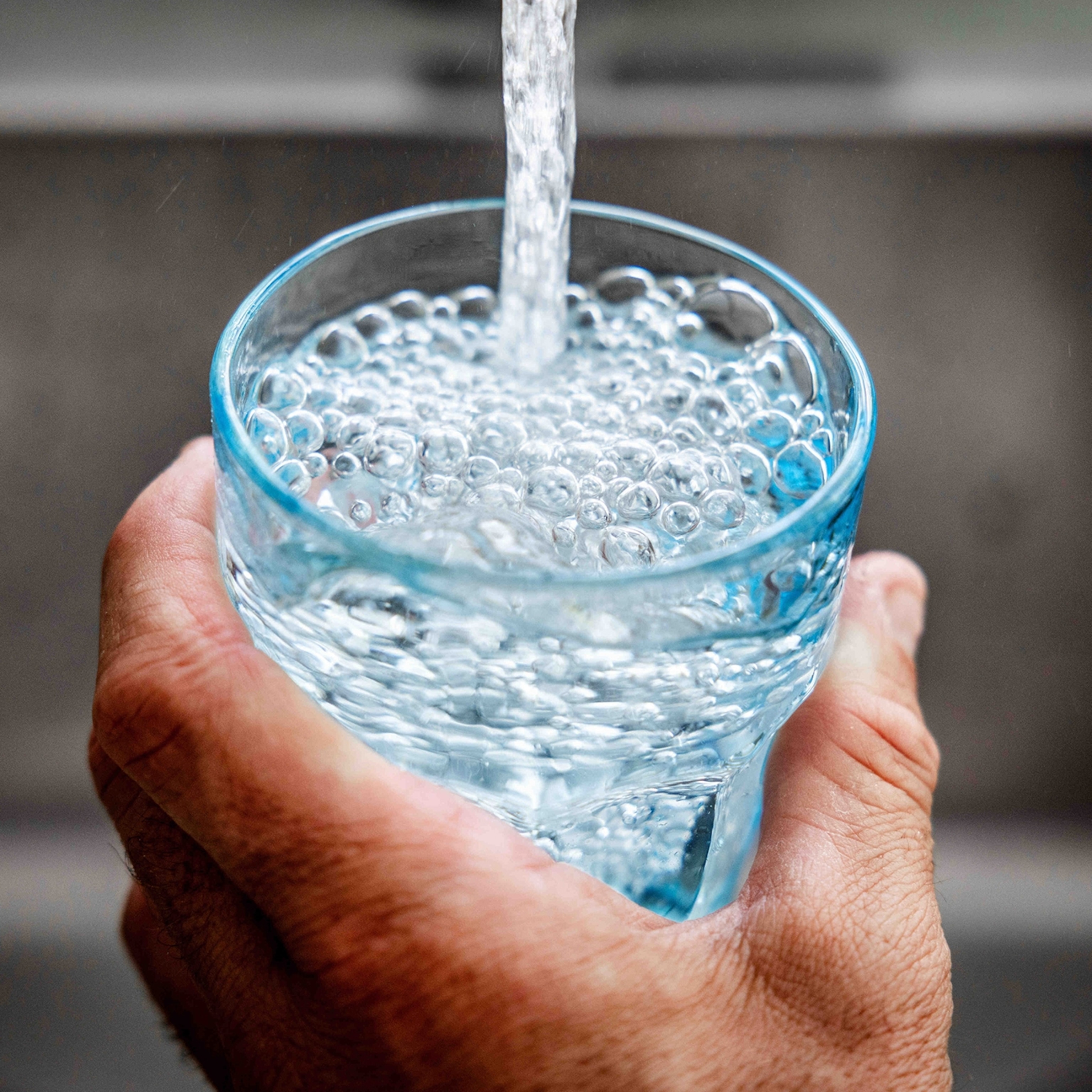Drinking water flows from the tap.