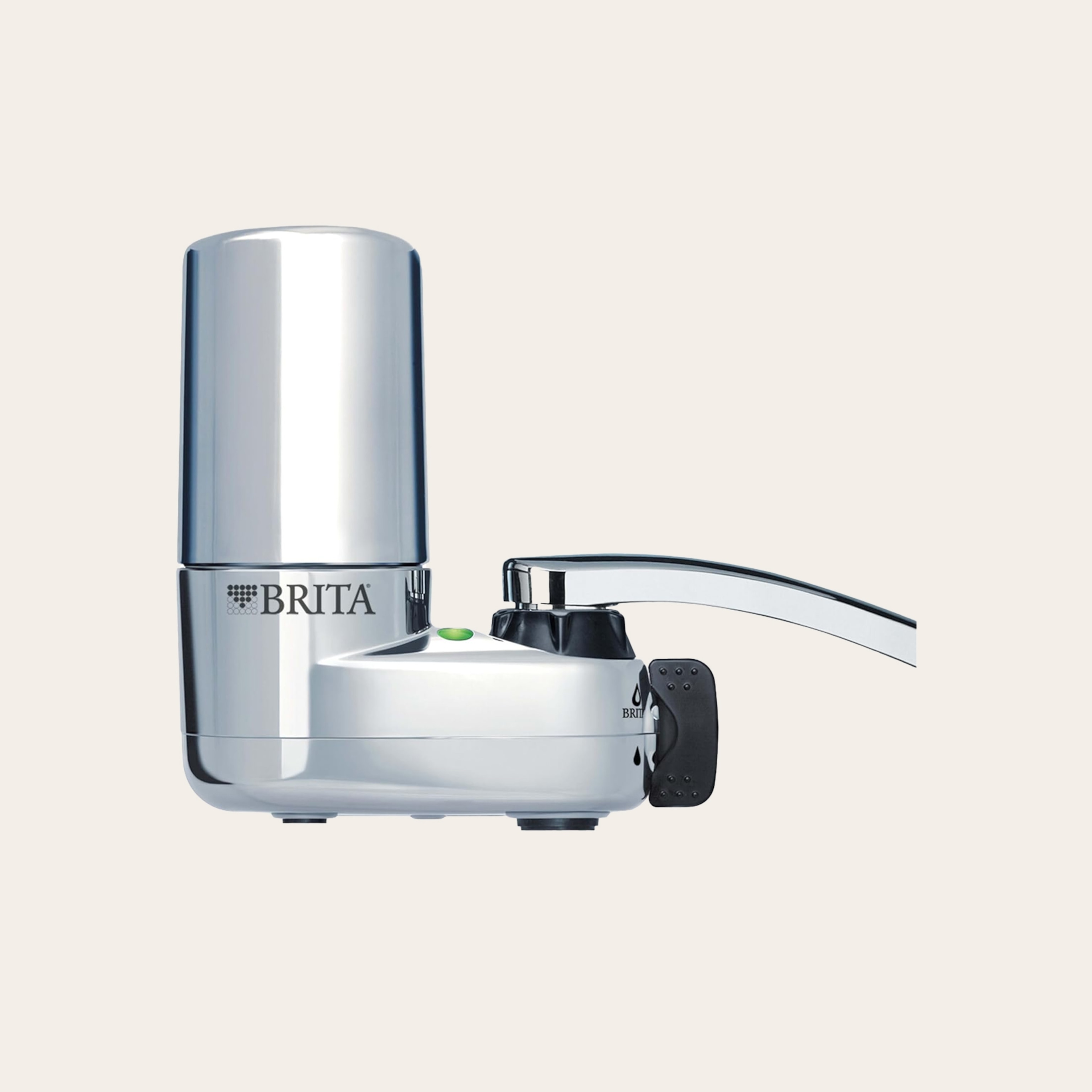 A silver water filter attached to the end of a kitchen faucet, against a tan background.
