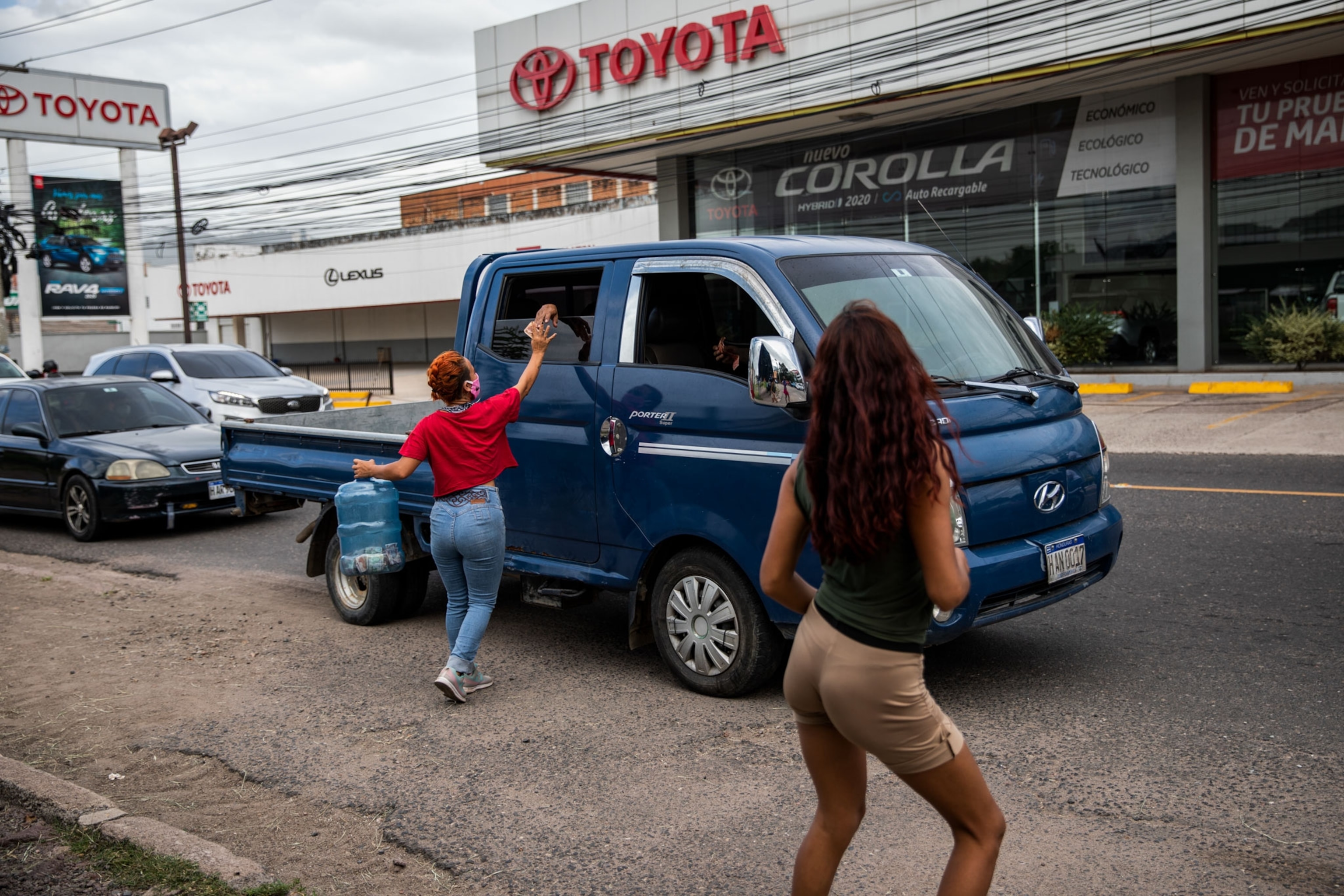circus performers doing a roadside routine for donations in Honduras