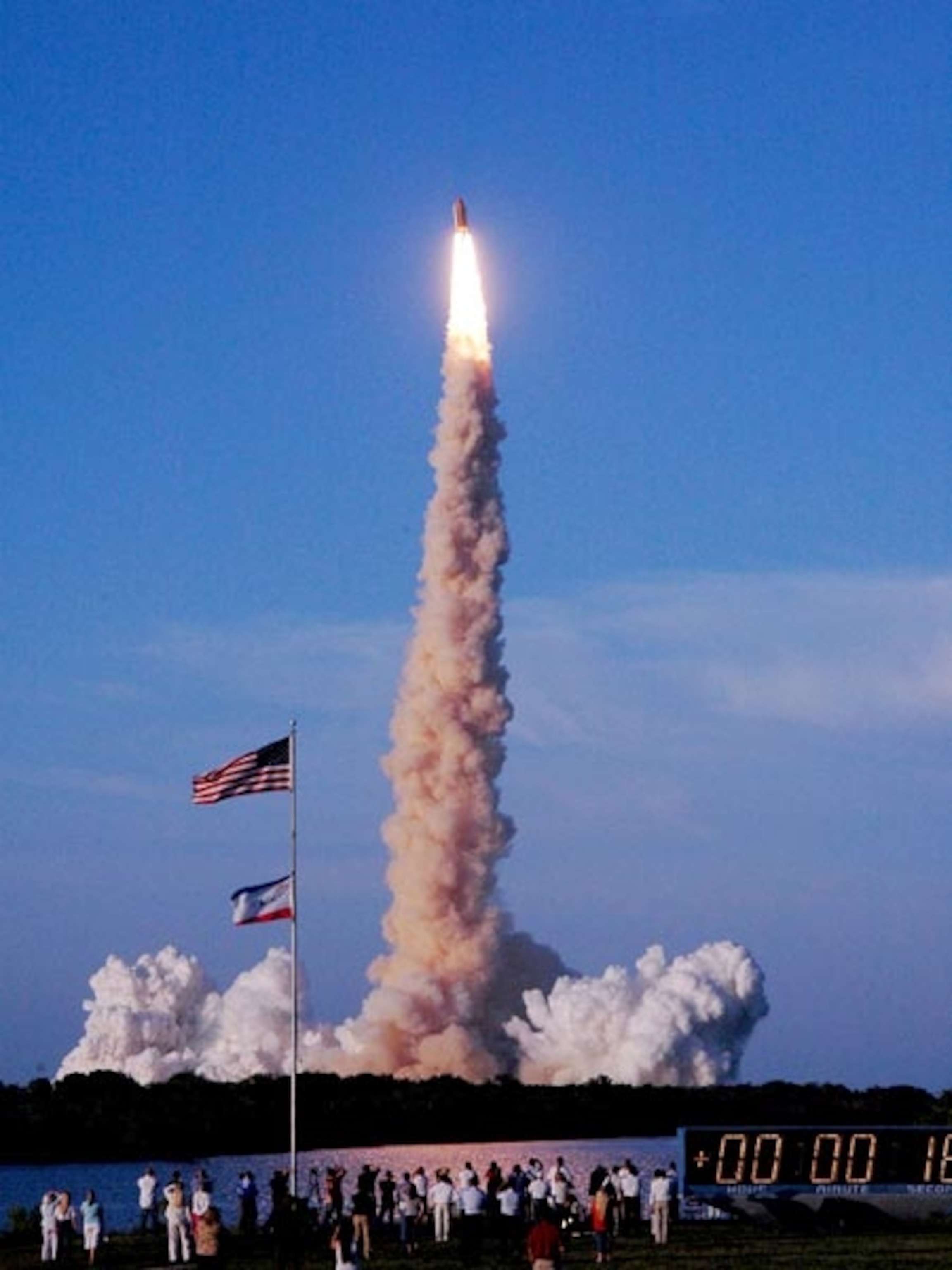 a column of smoke under shuttle