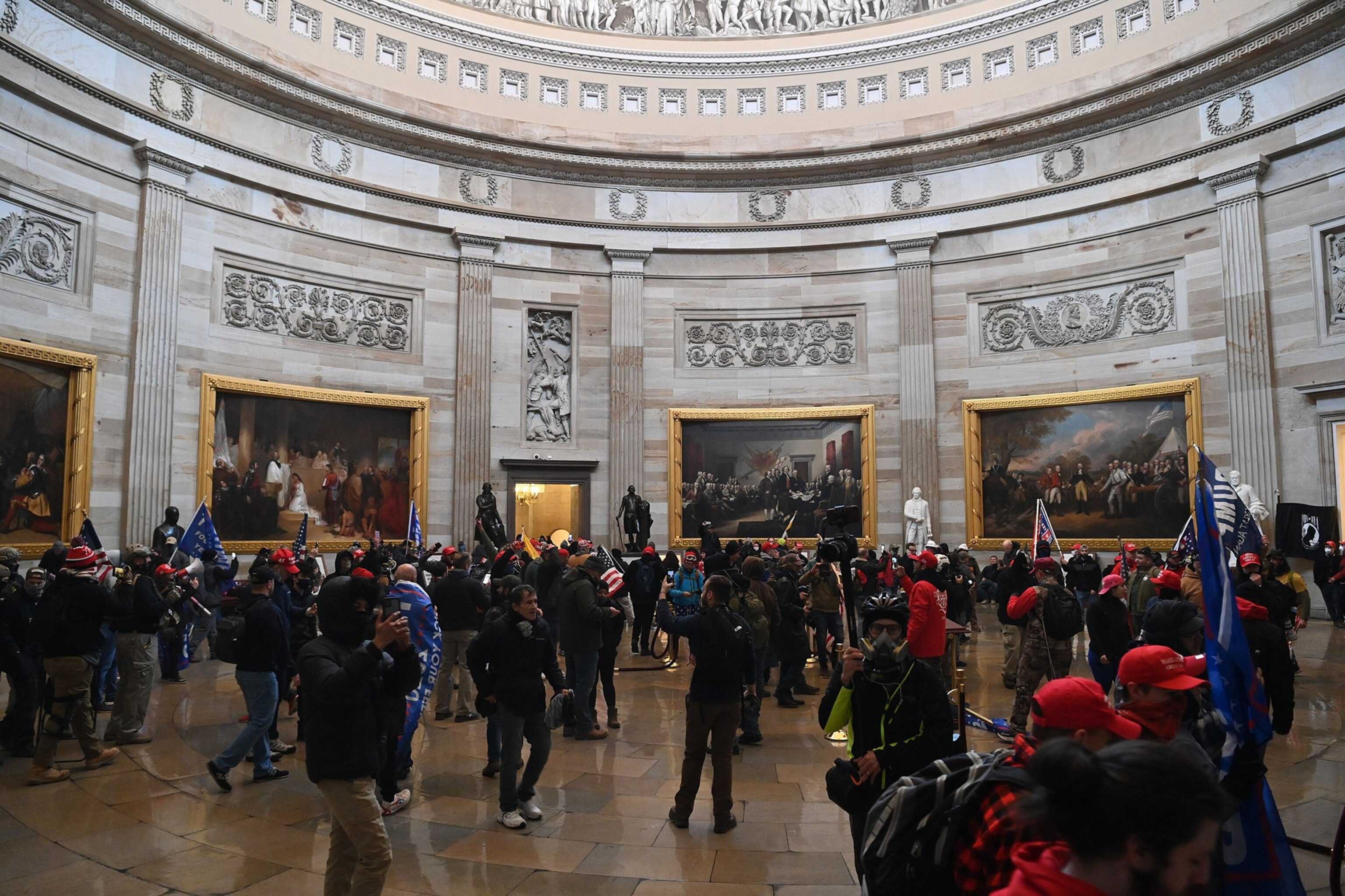 Supporters of US President Donald Trump enter the US Capitol's Rotund