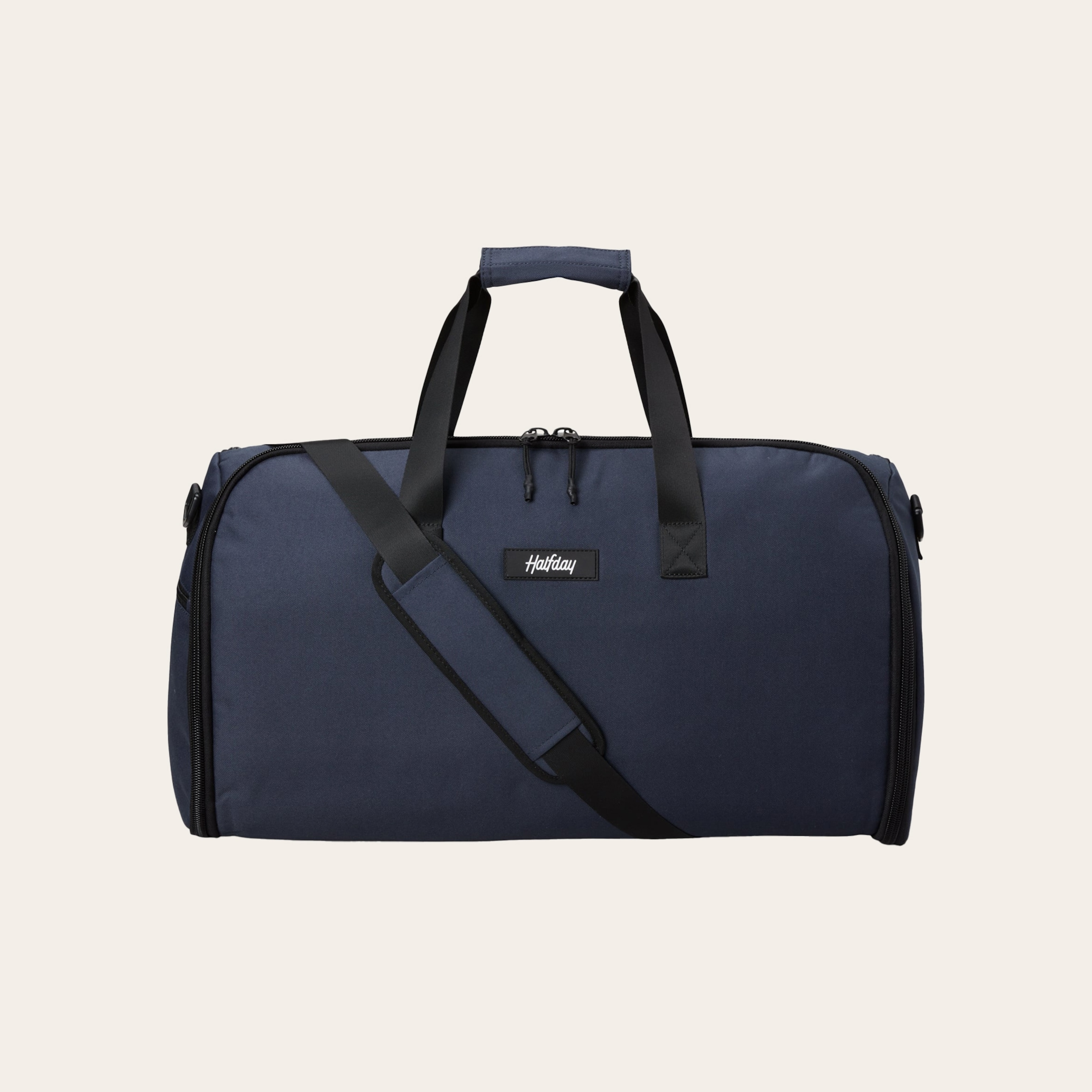 A black duffel bag against a tan background.