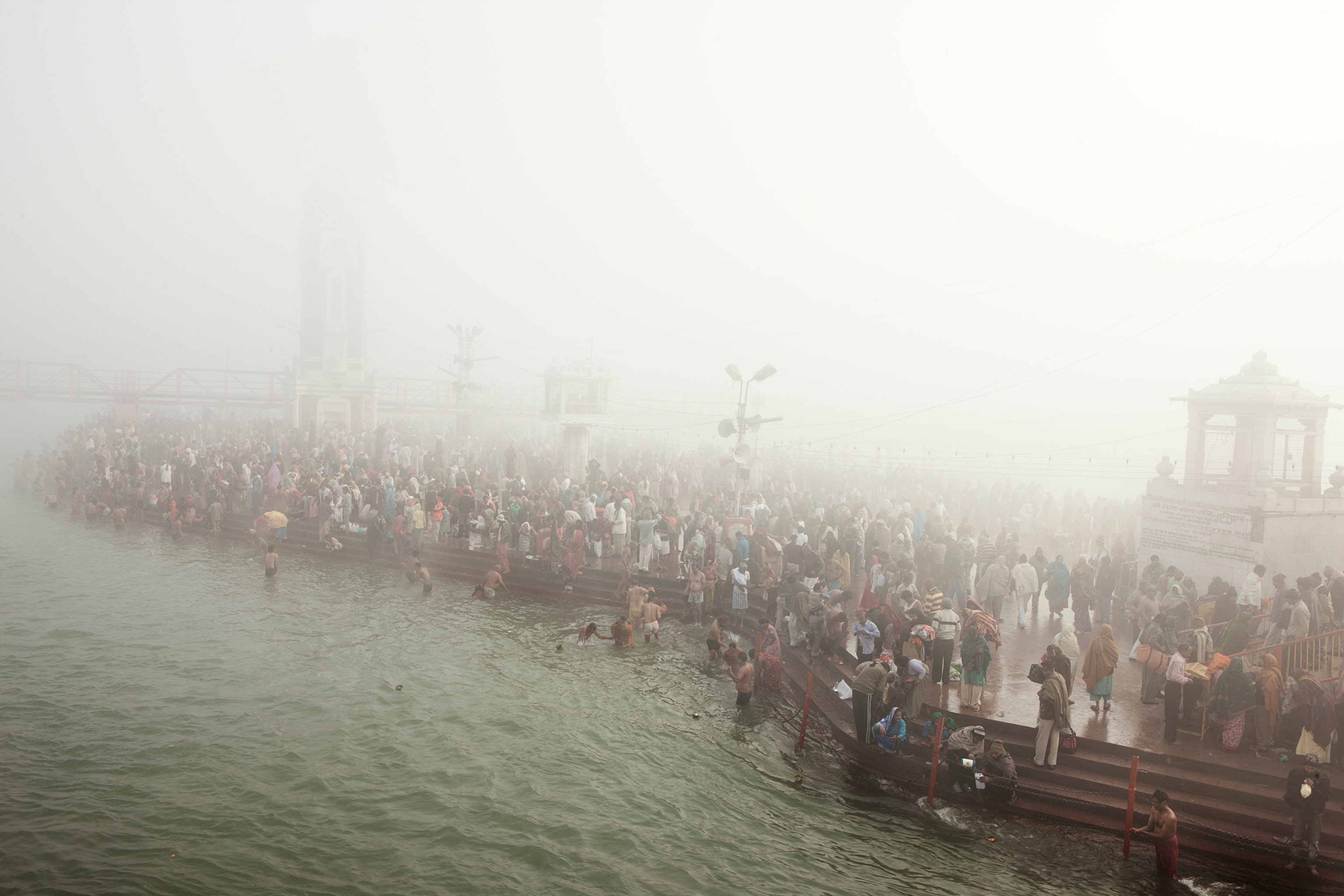 Hindu devotees bathe in the Ganges during the Kumbh Mela, India 2010