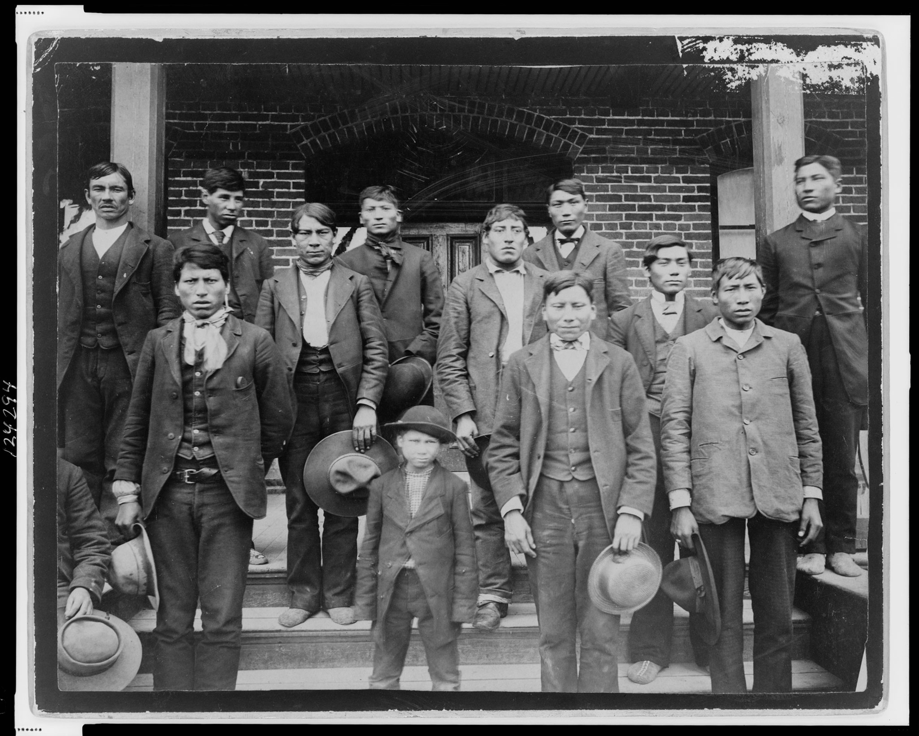 Native American boys posing outside the Carlisle Indian School
