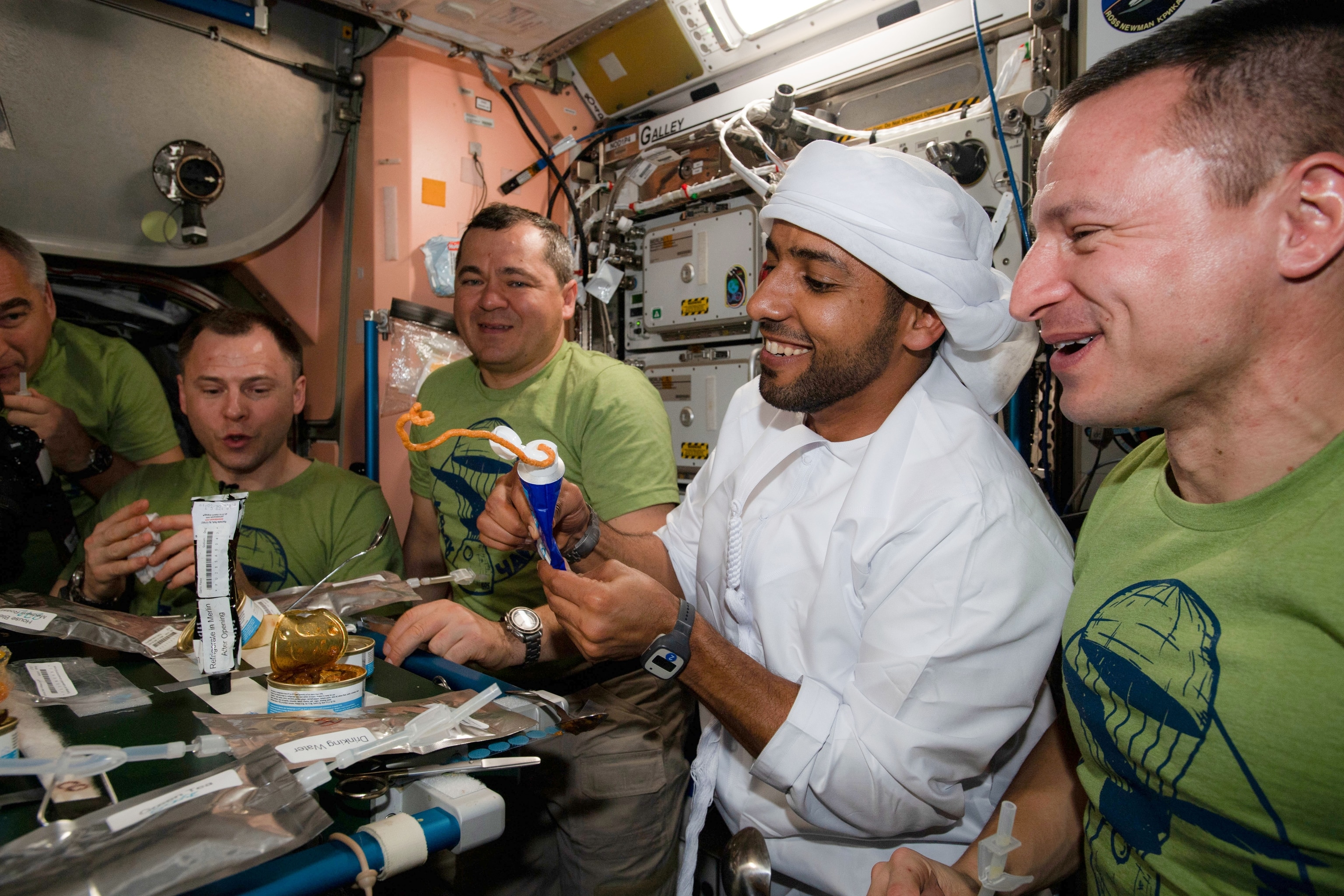the ISS crew having dinner.