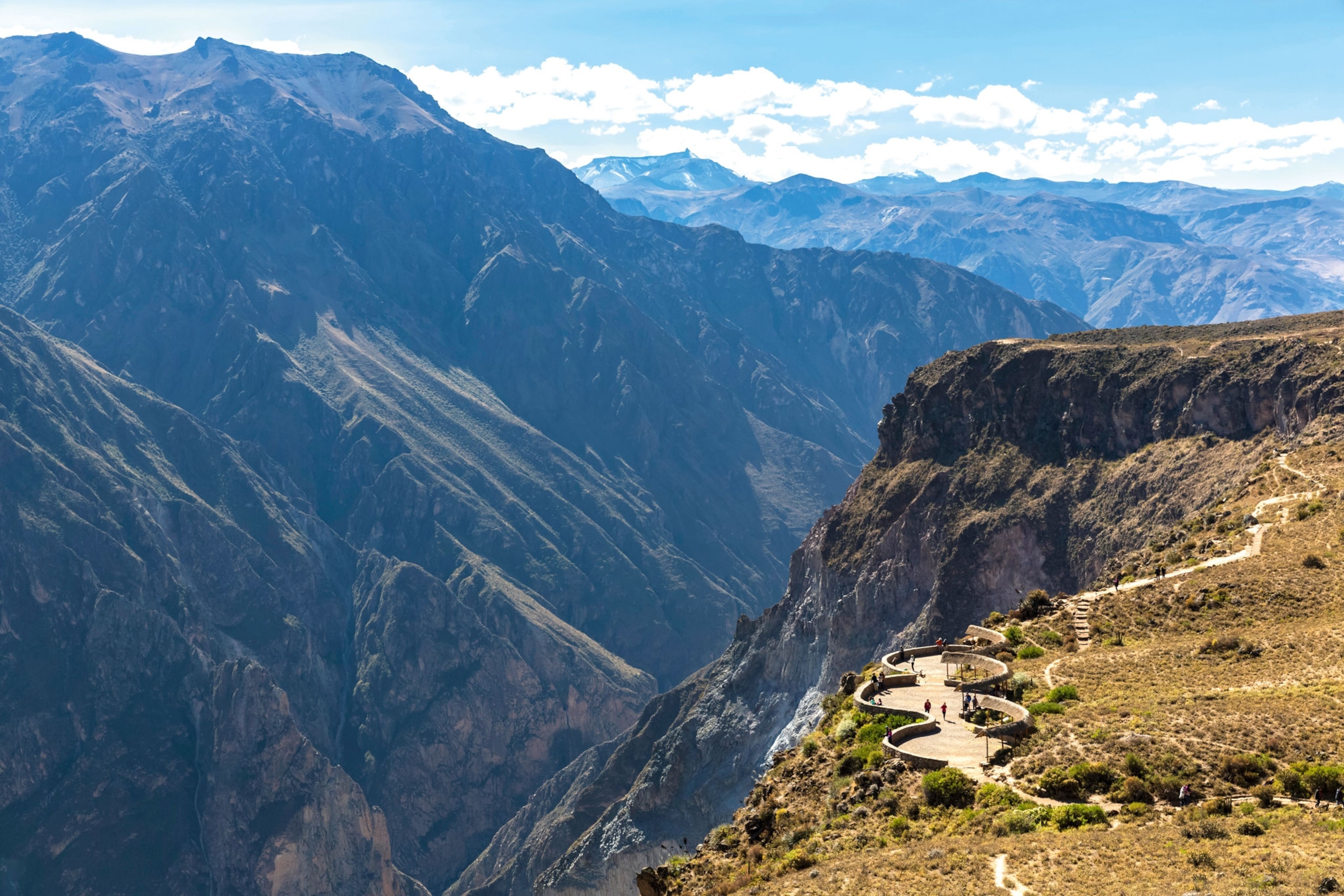 Mountainous landscape with a winding walkway on its edge