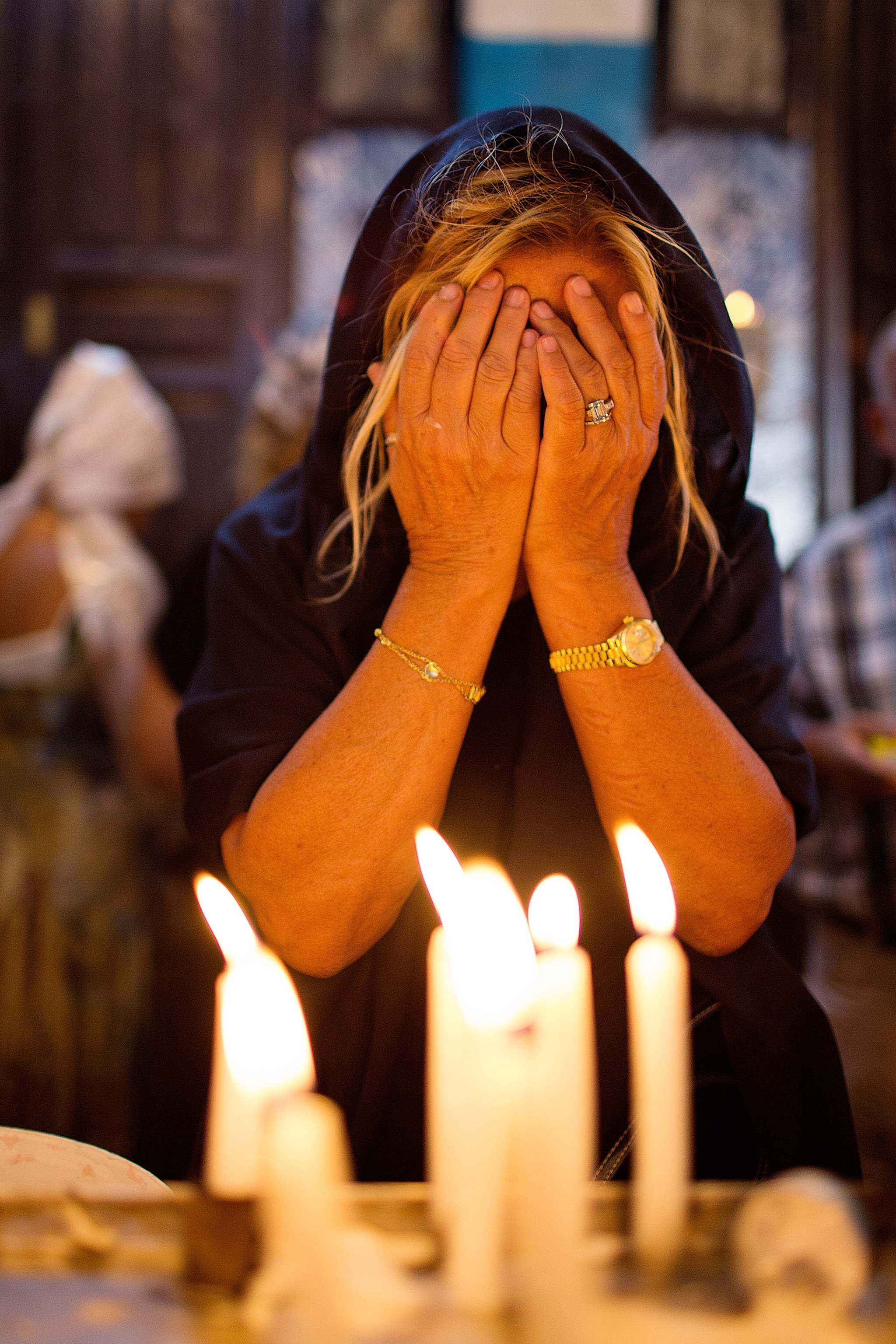 a woman praying inside the Ghriba Synagogue in Djerba, Tunisia