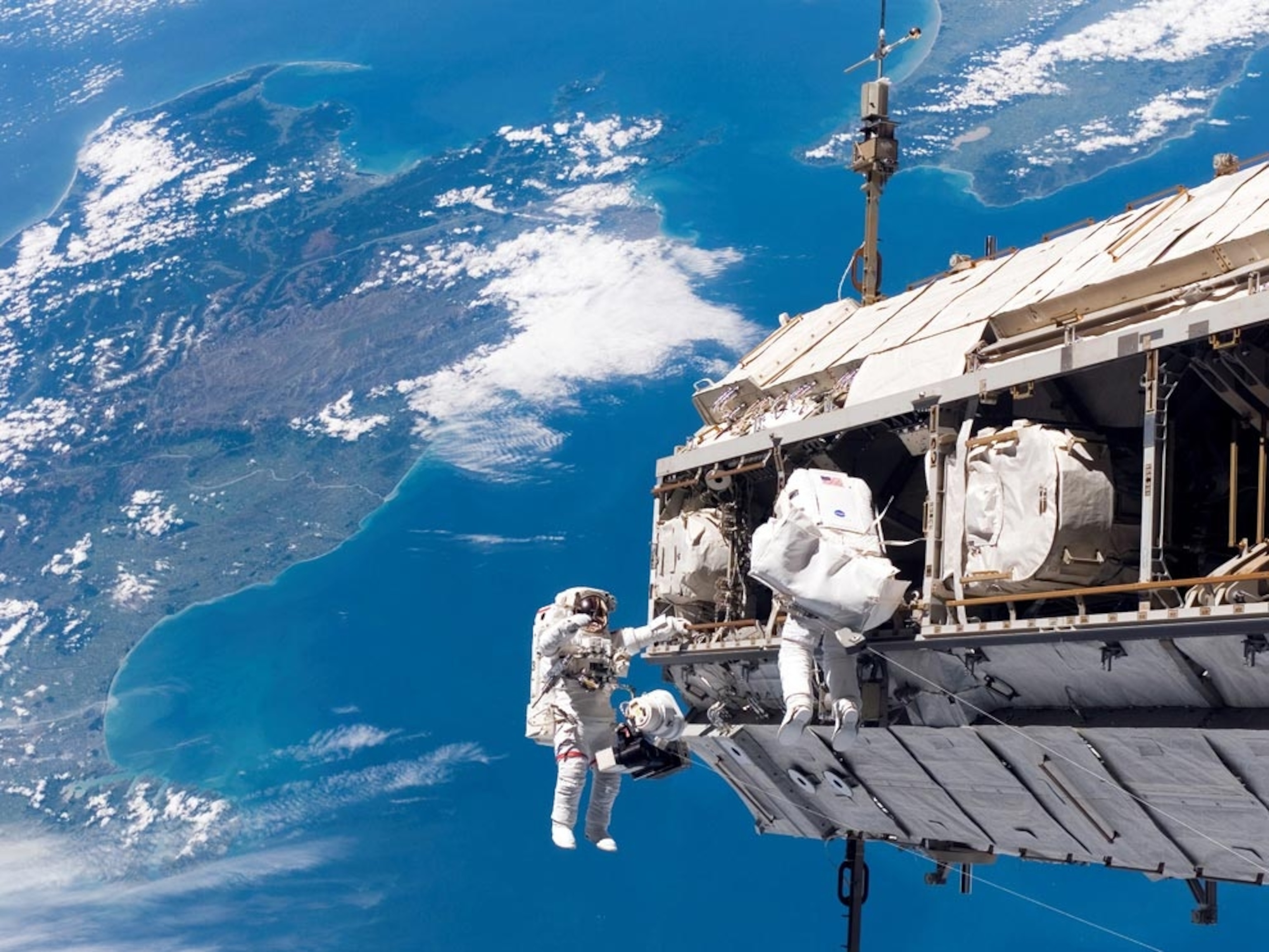 astronauts working on International Space Station