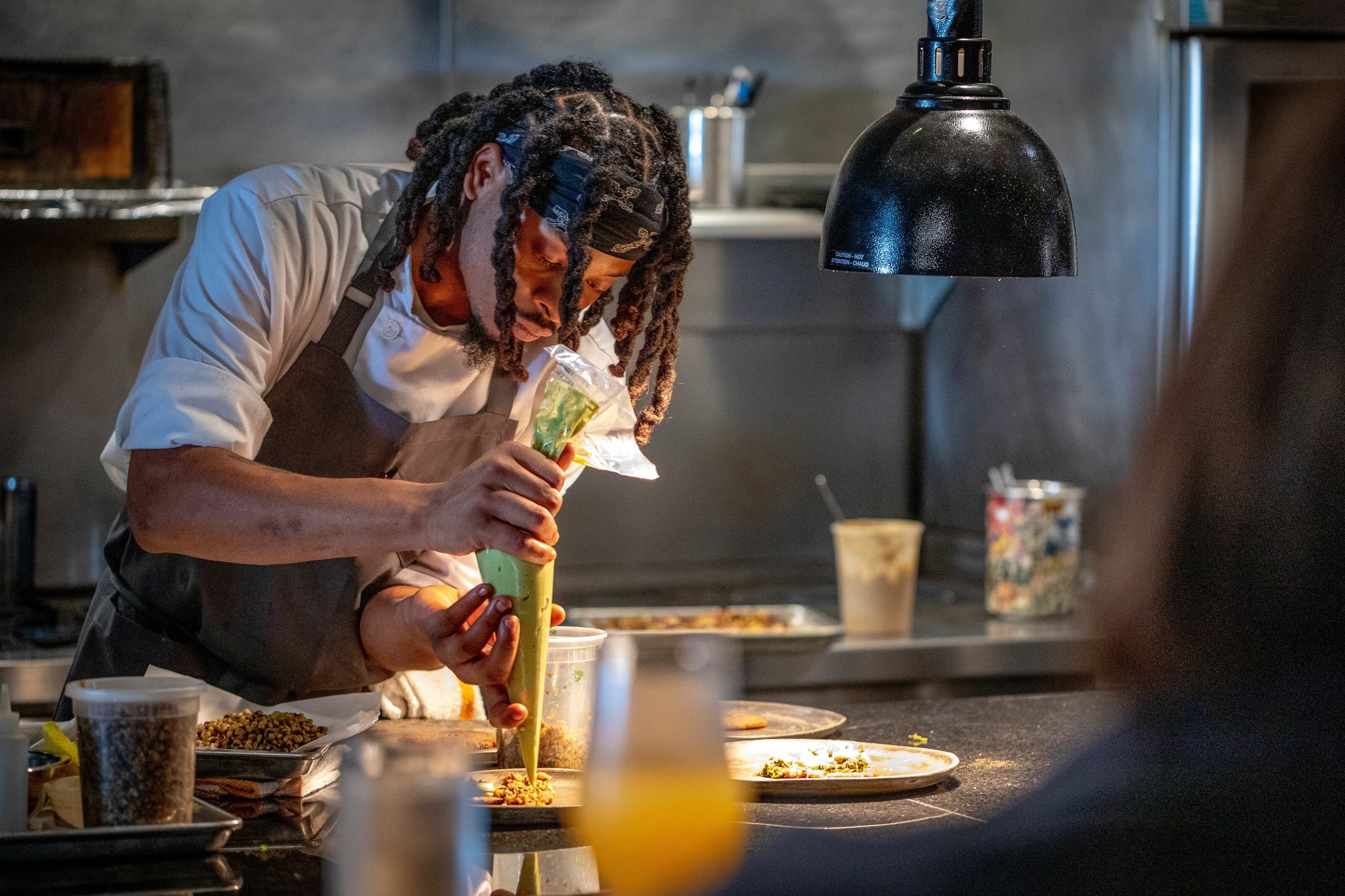 Chef de tournant John Johnson puts the finishing touches to the ratatouille at Dory.