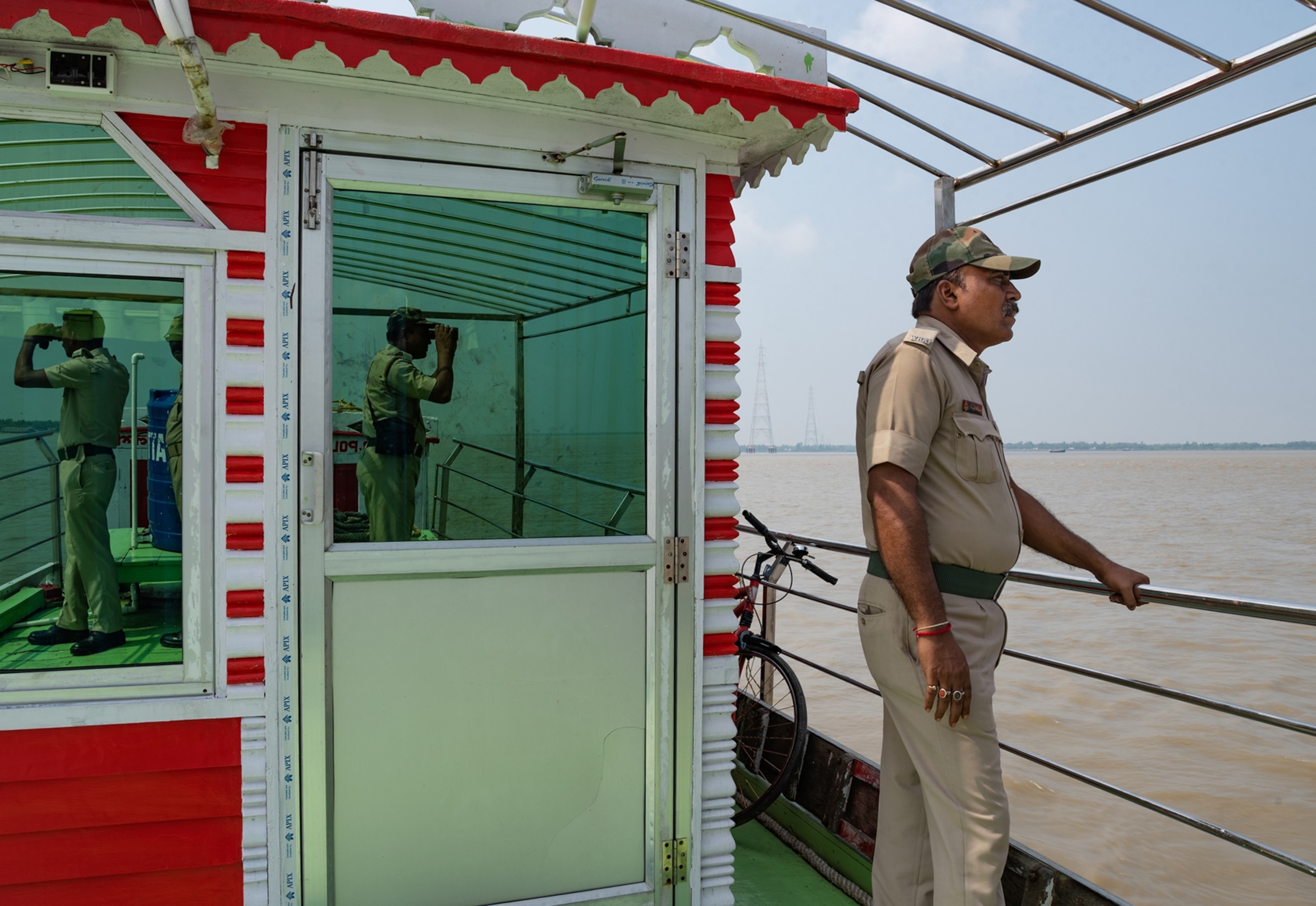 police officer standing on boat.