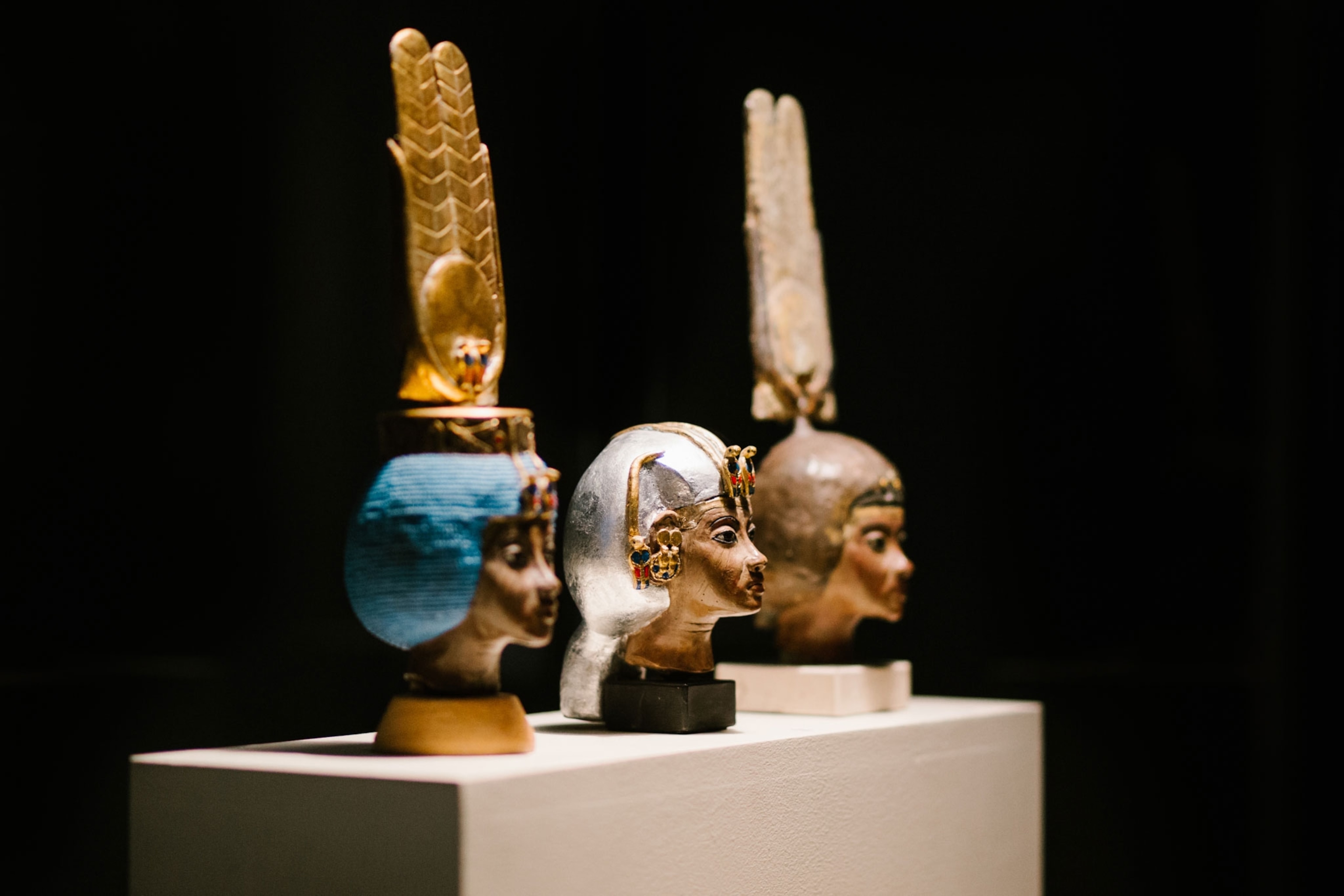 Three busts of an Egyptian queen