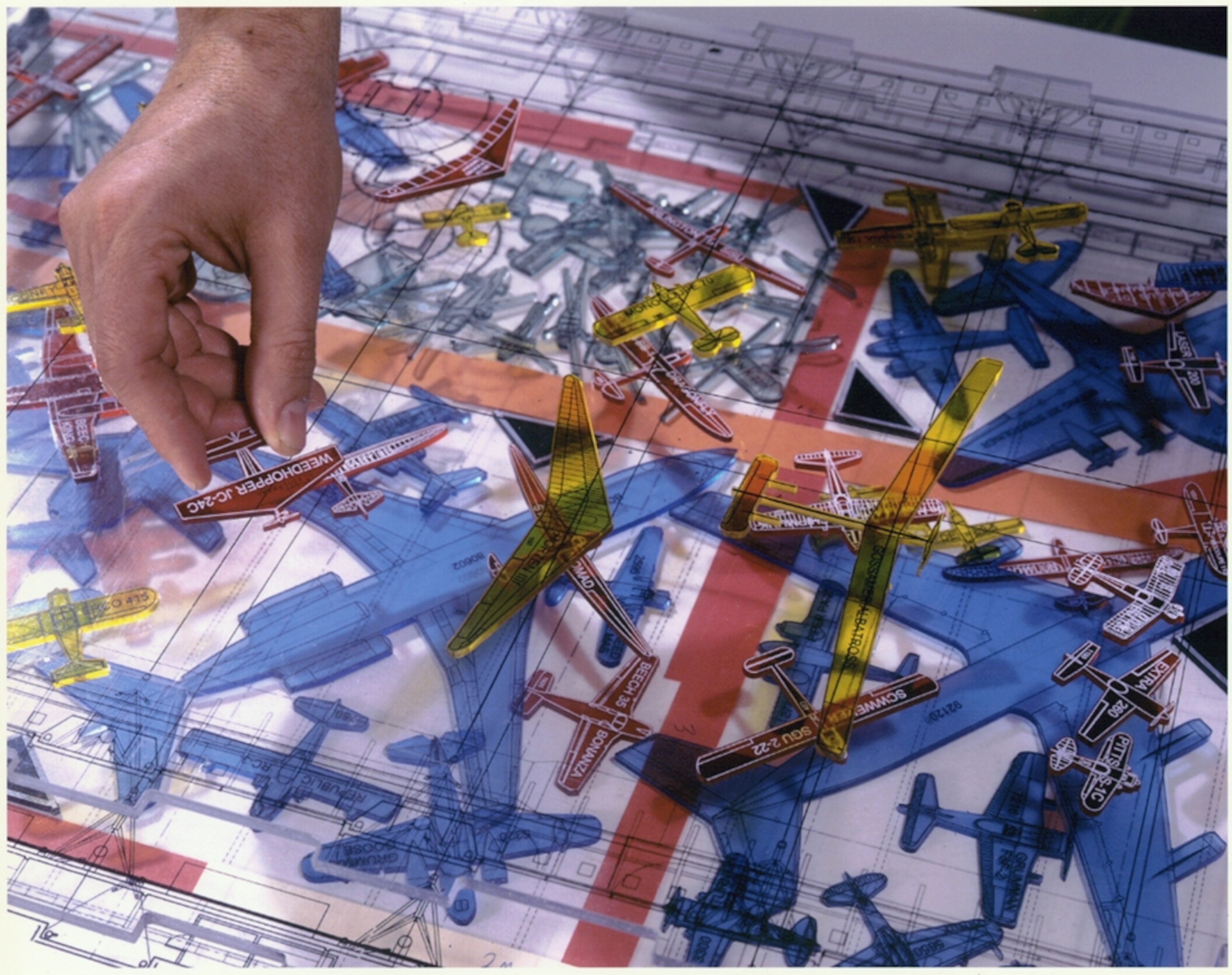 plastic plane cutout models being arranged.