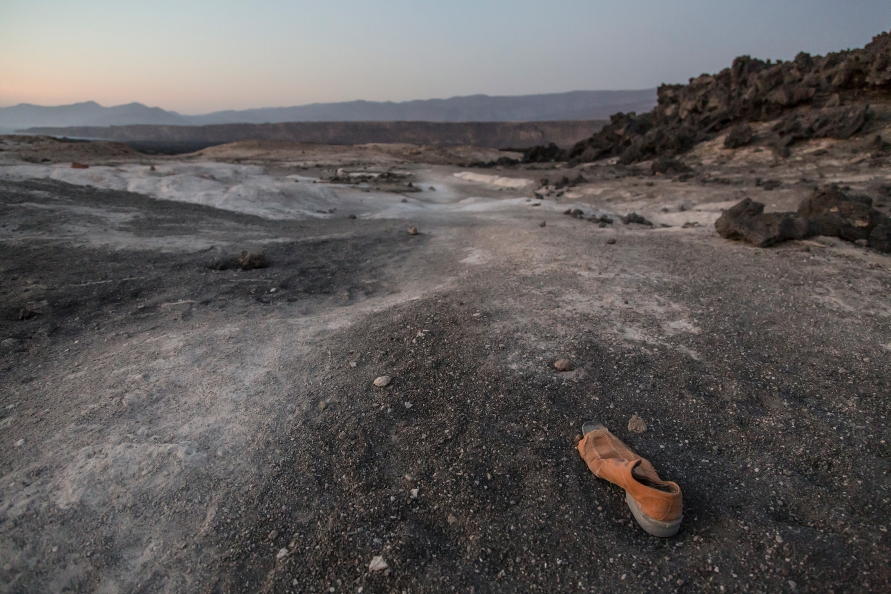 Photo of one shoe left in desert