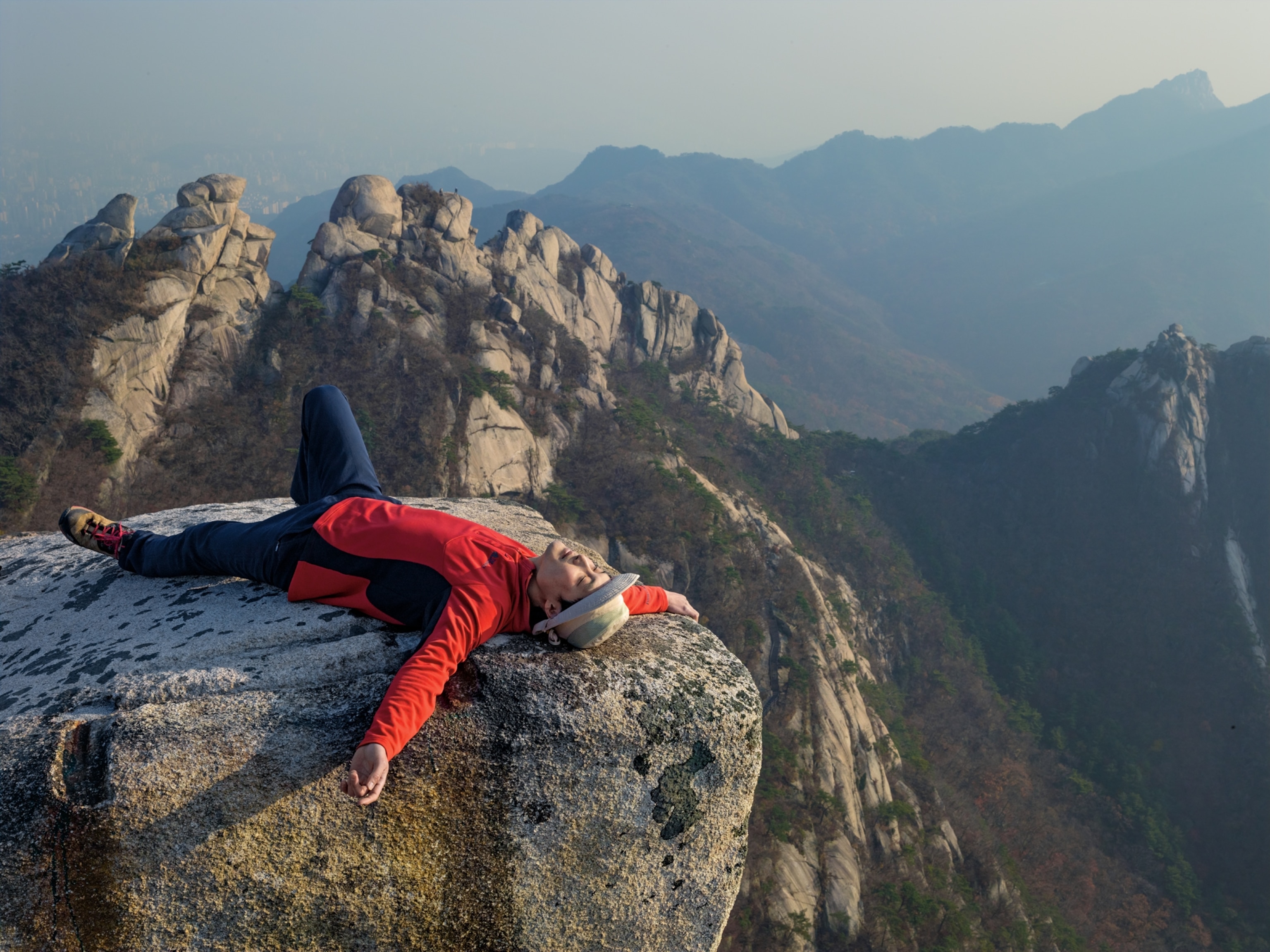 Man rests after hiking in Bukhansan National Park