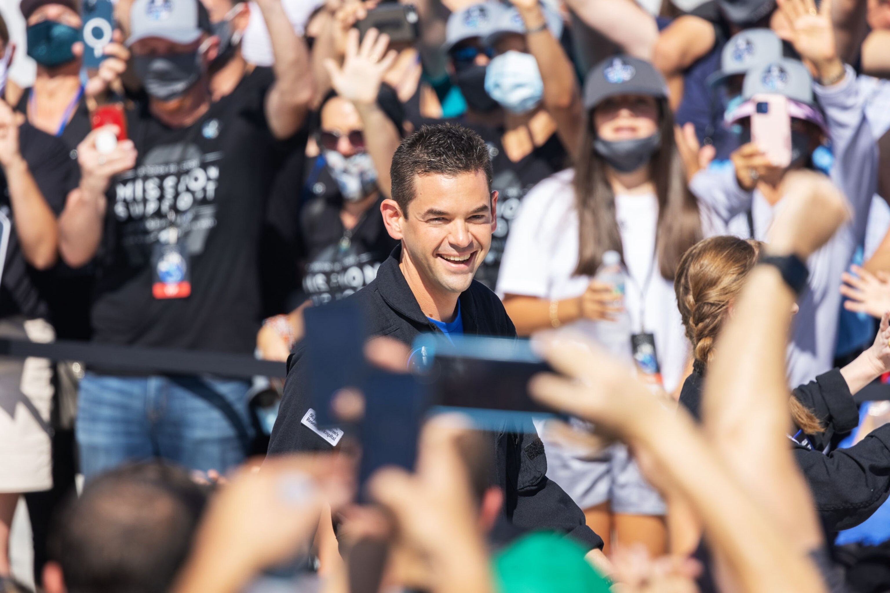 Inspriation4 crewmember Jared Isaacman waves to the crowd