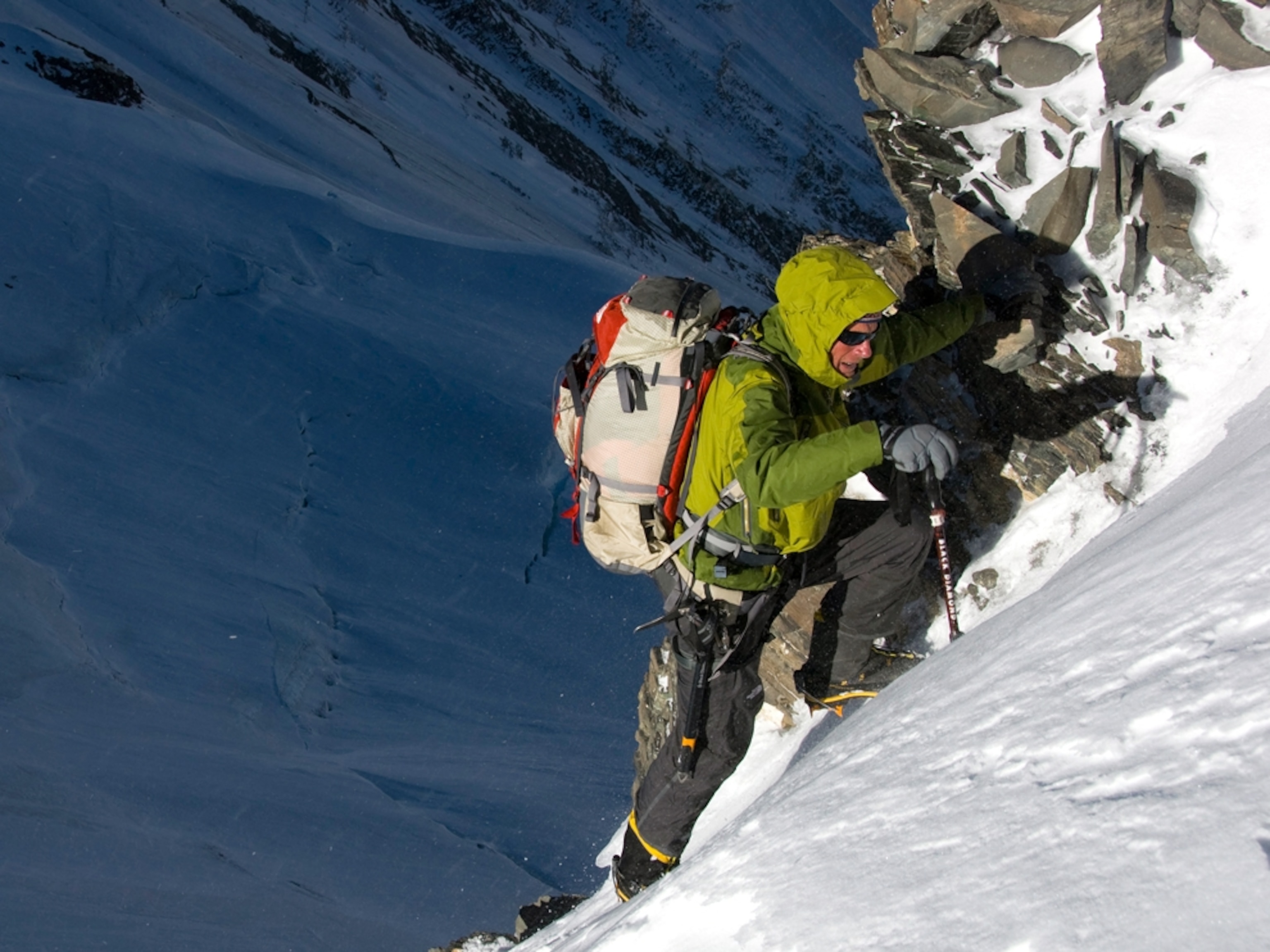 Climber on nearly vertical rock formation