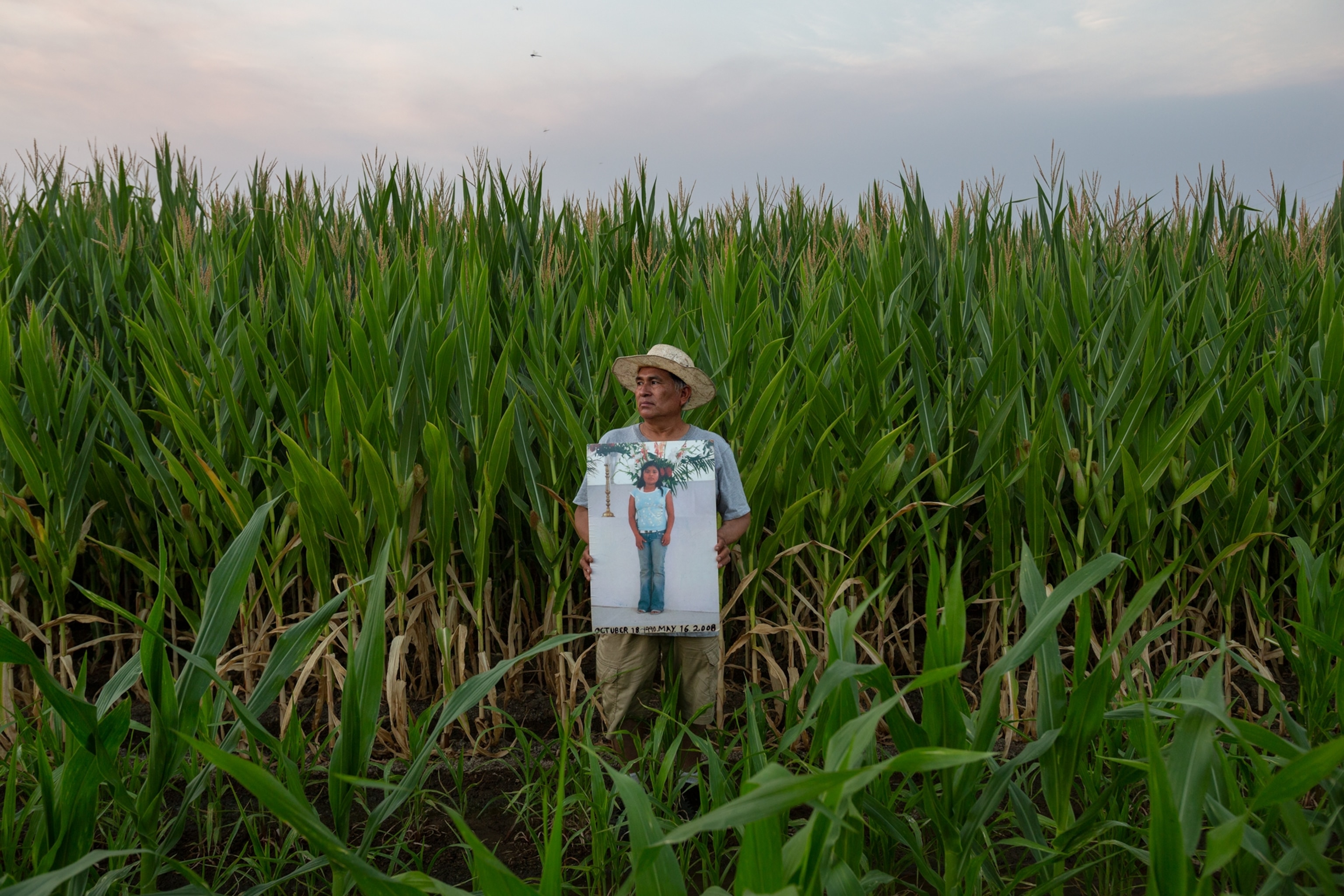 Picture of man holding a large photo portrait