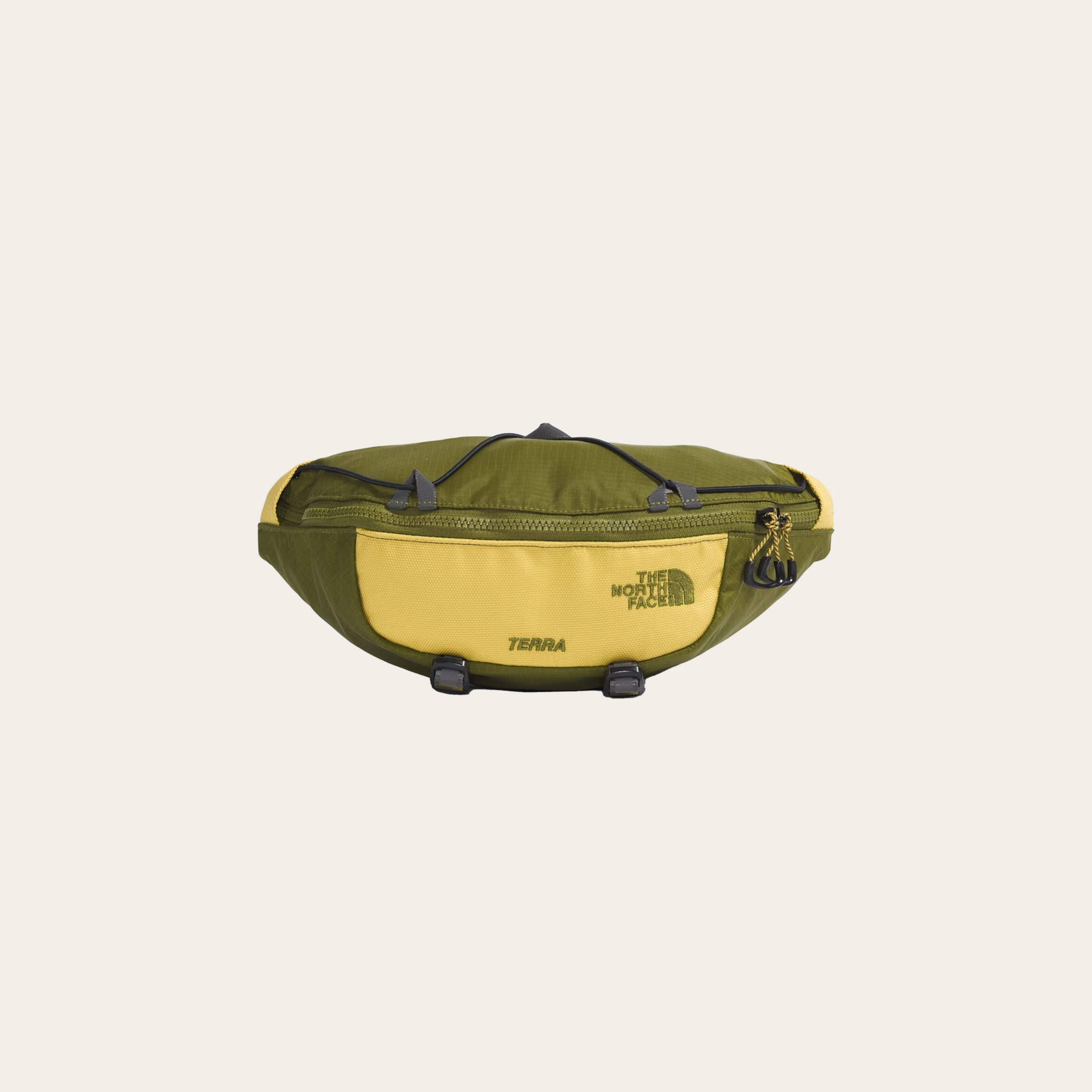 A yellow and green bag with on a cream background.
