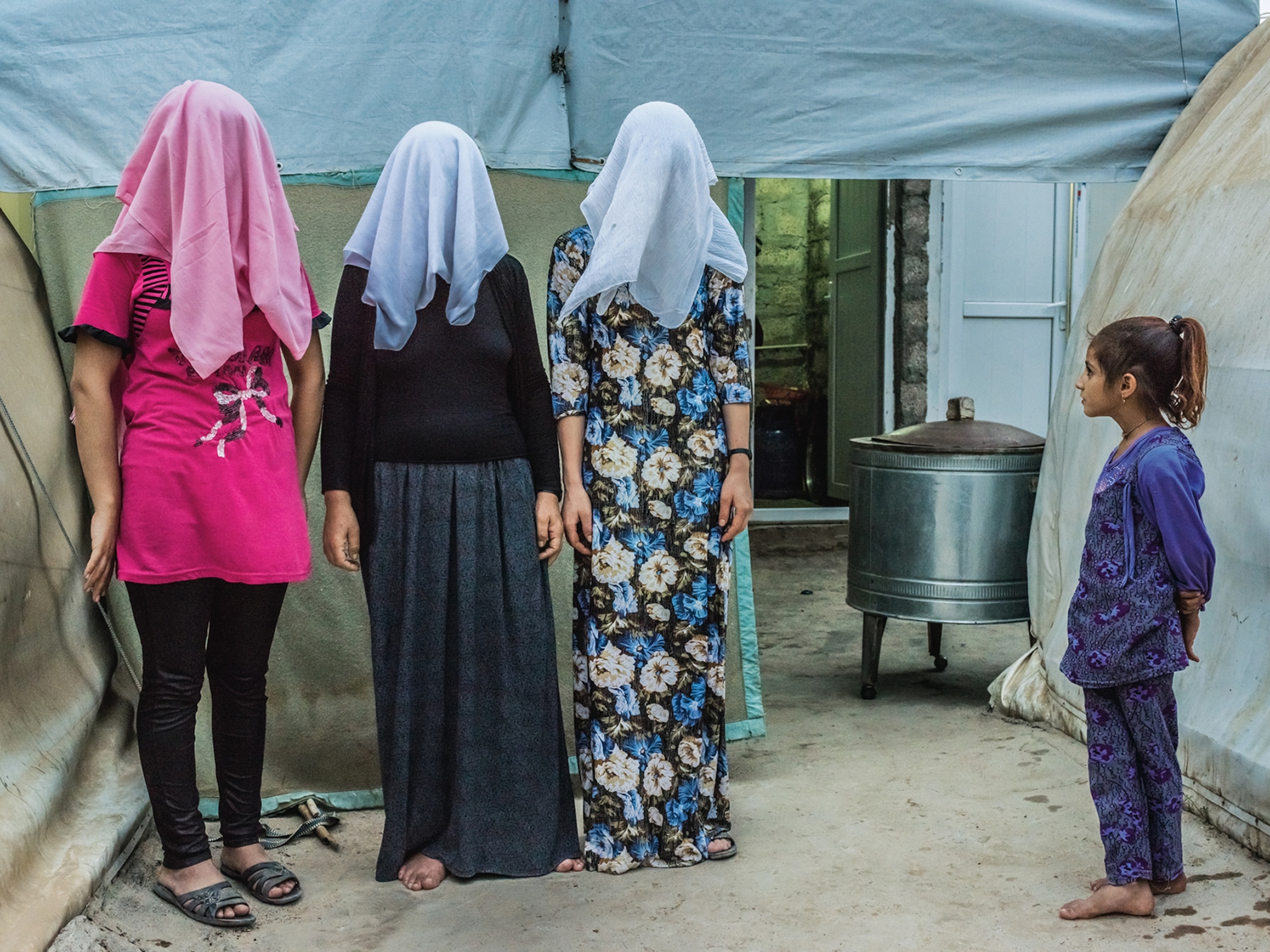 three Yazidi Kurdish women who escaped from ISIS fighters