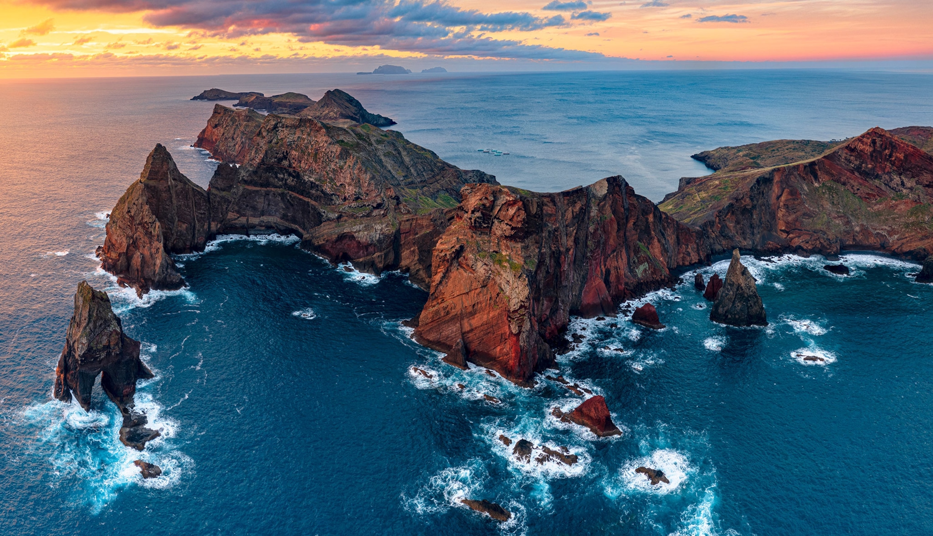 Aerial panoramic of cliffs and Sao Lourenco Peninsula at dawn from Ponta do Rosto viewpoint, Madeira island, Portugal