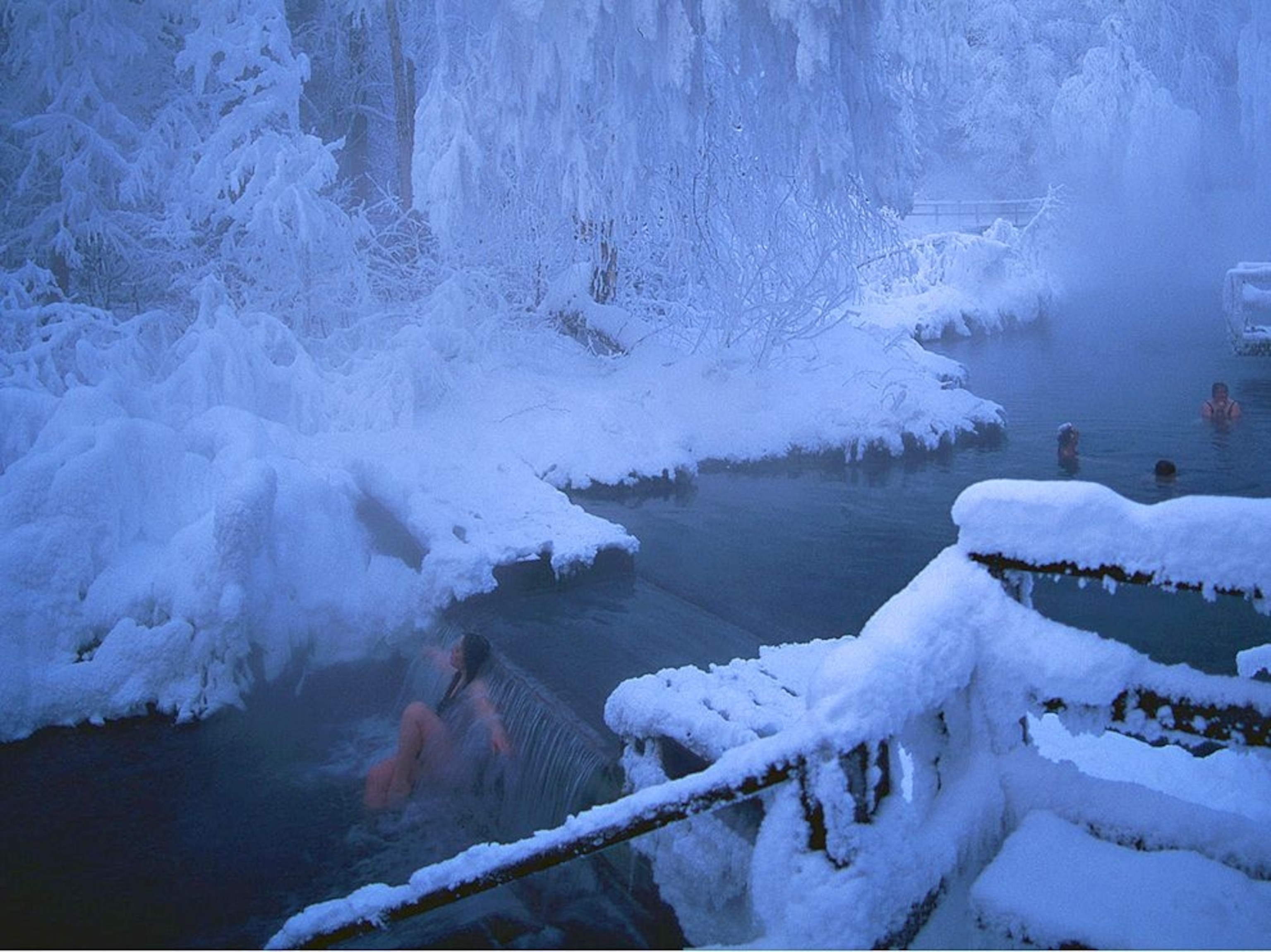 a woman in Liard Hot Springs in winter, British Columbia, Canada