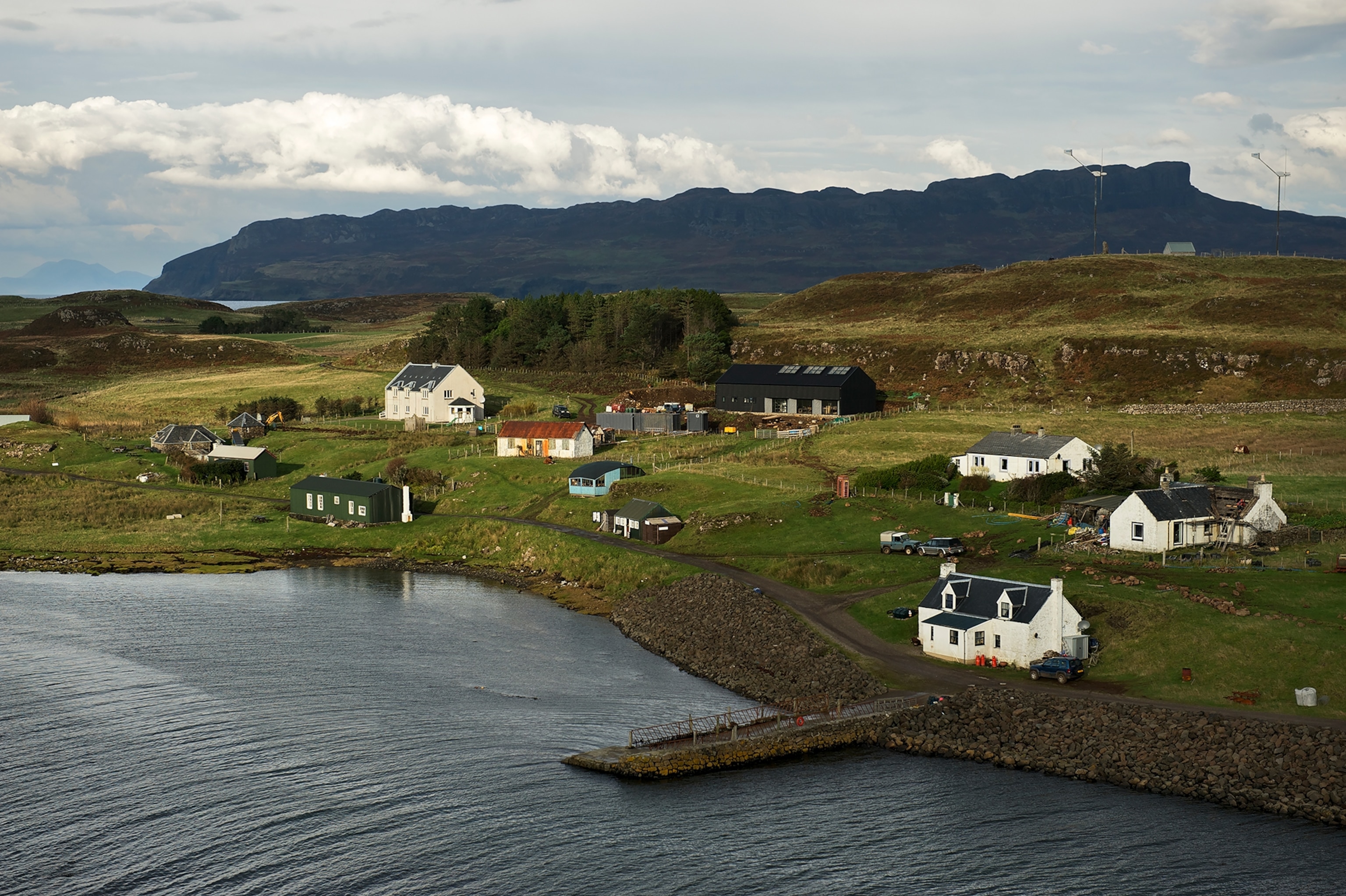 Soft light fills the coast of a small seaside village.