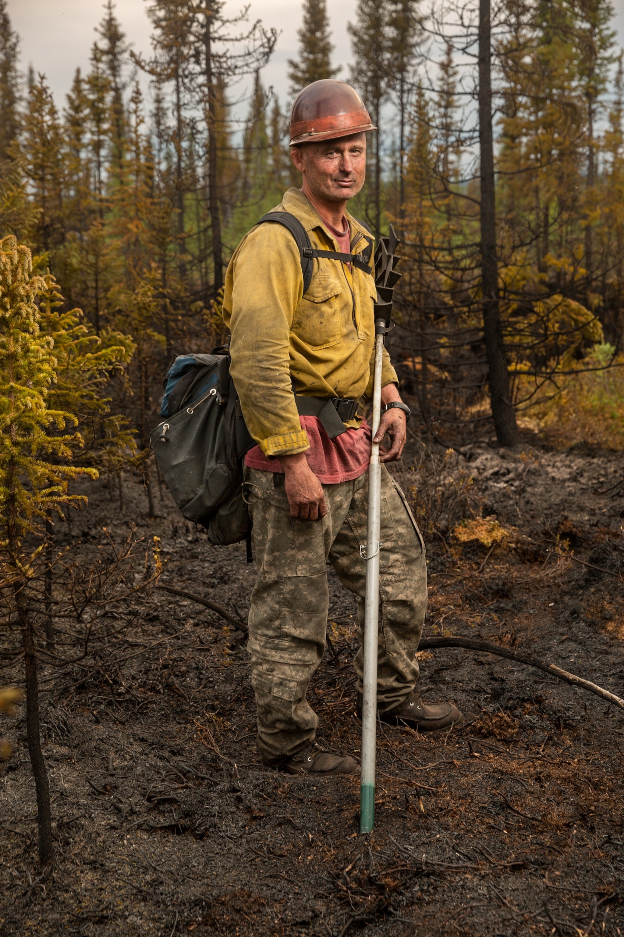 a man in yellow jacket and red hardhat
