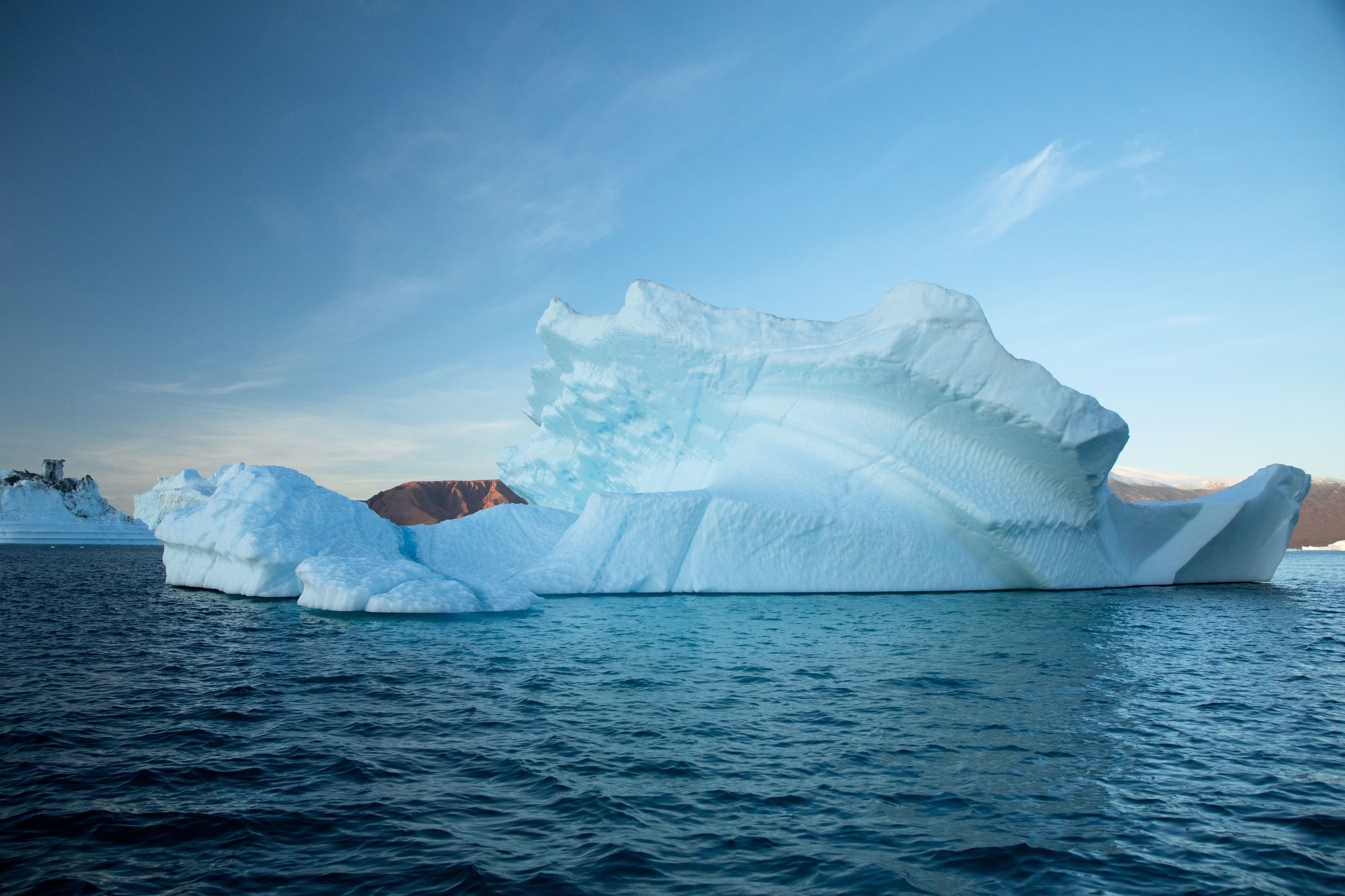 a large glacier drifting in water