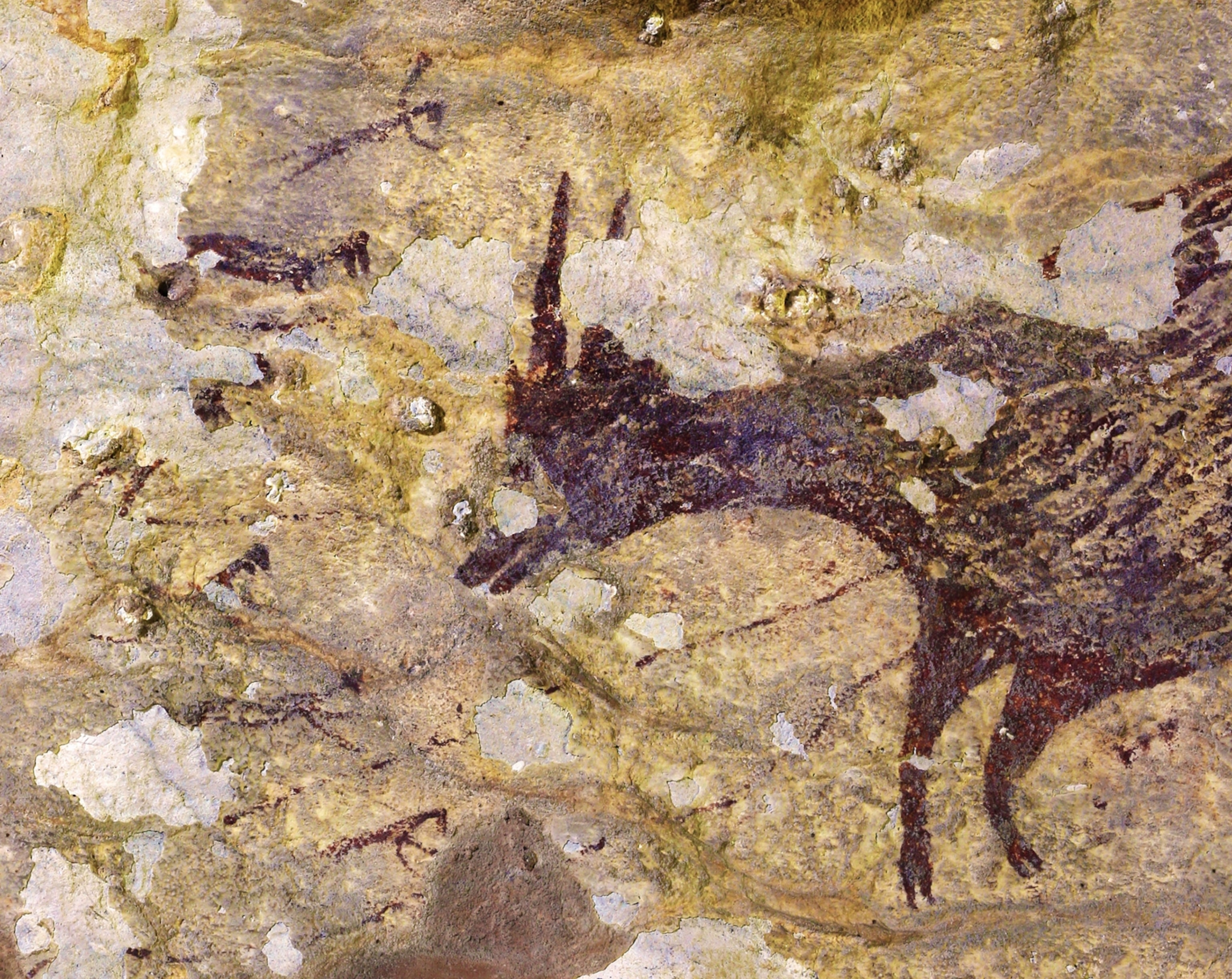 Early cave art of a hunting scene.