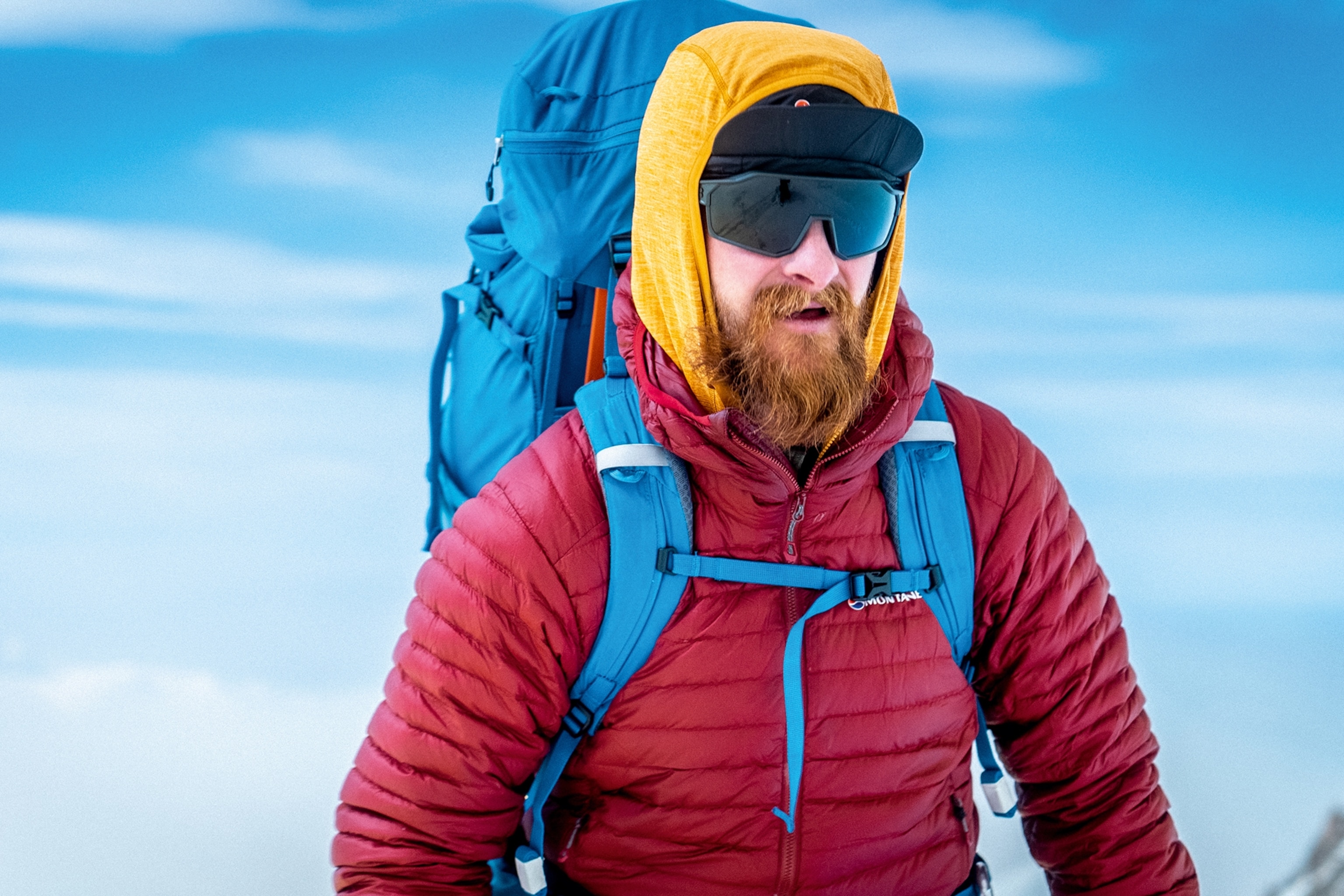 Close-up shot of Ed Salisbury in winter gear with a backpack on.