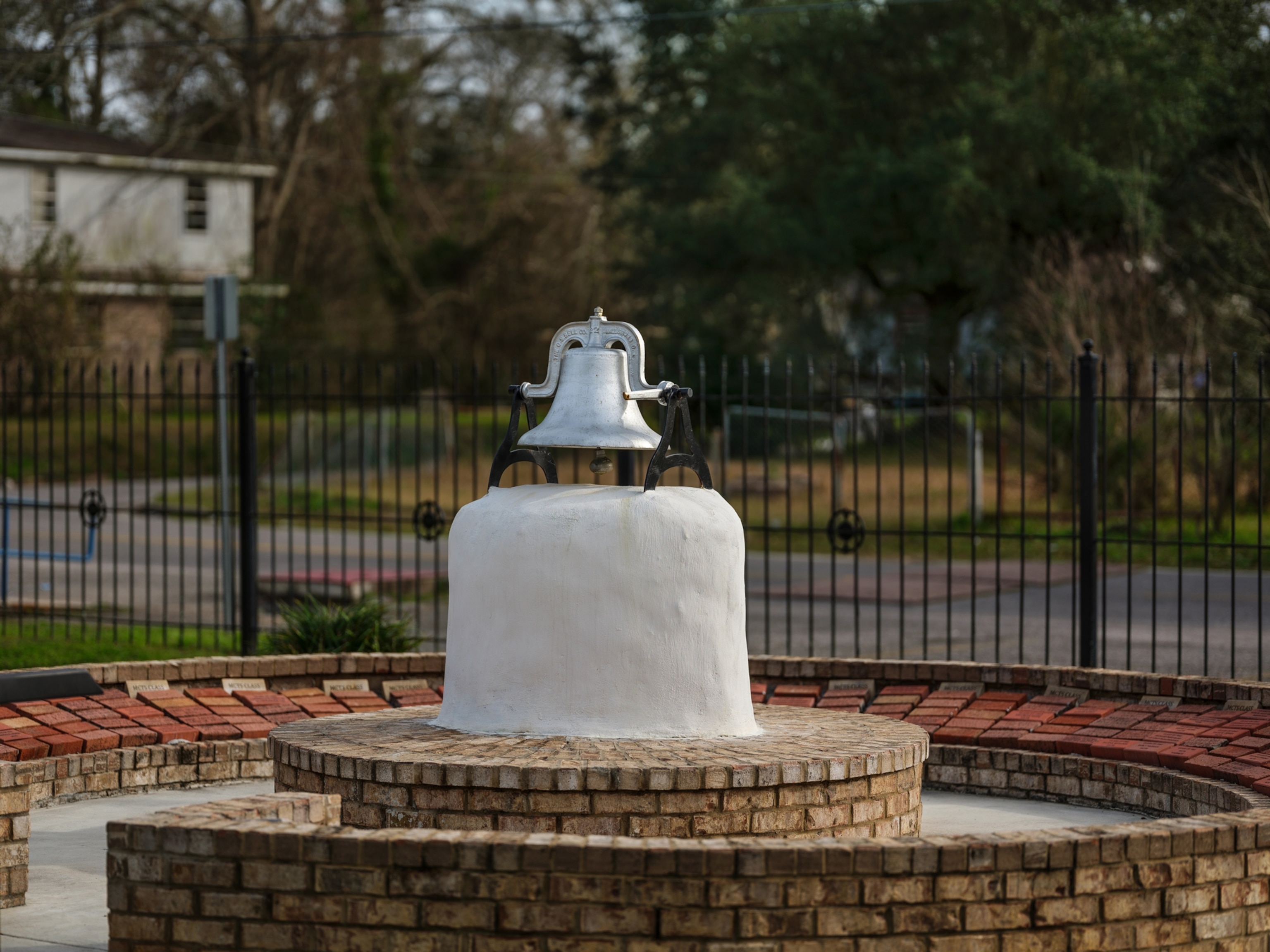 a silver bell inside a park