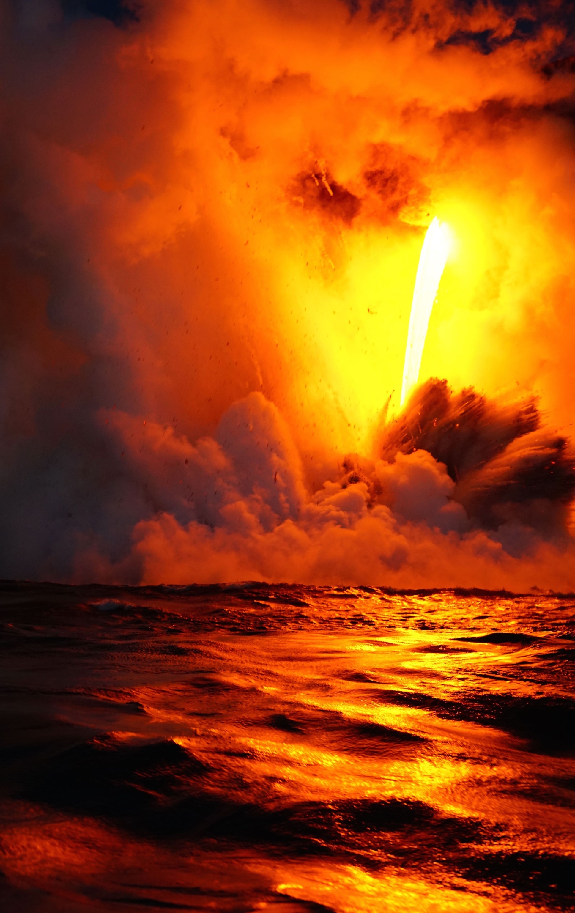 lava falling into the sea in Hawaii Volcano National Park