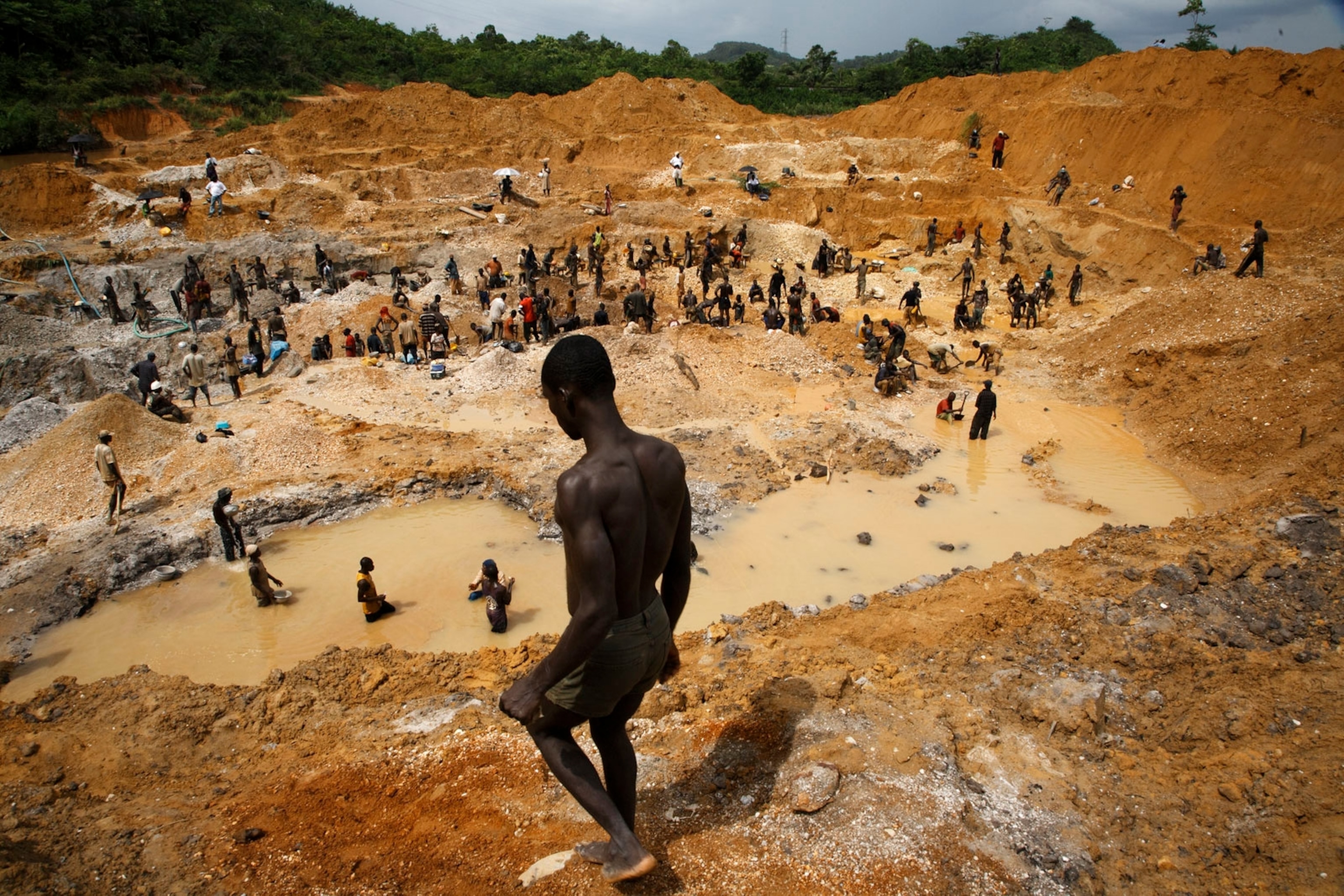 illegal miners at an abandoned field along the Pra River.