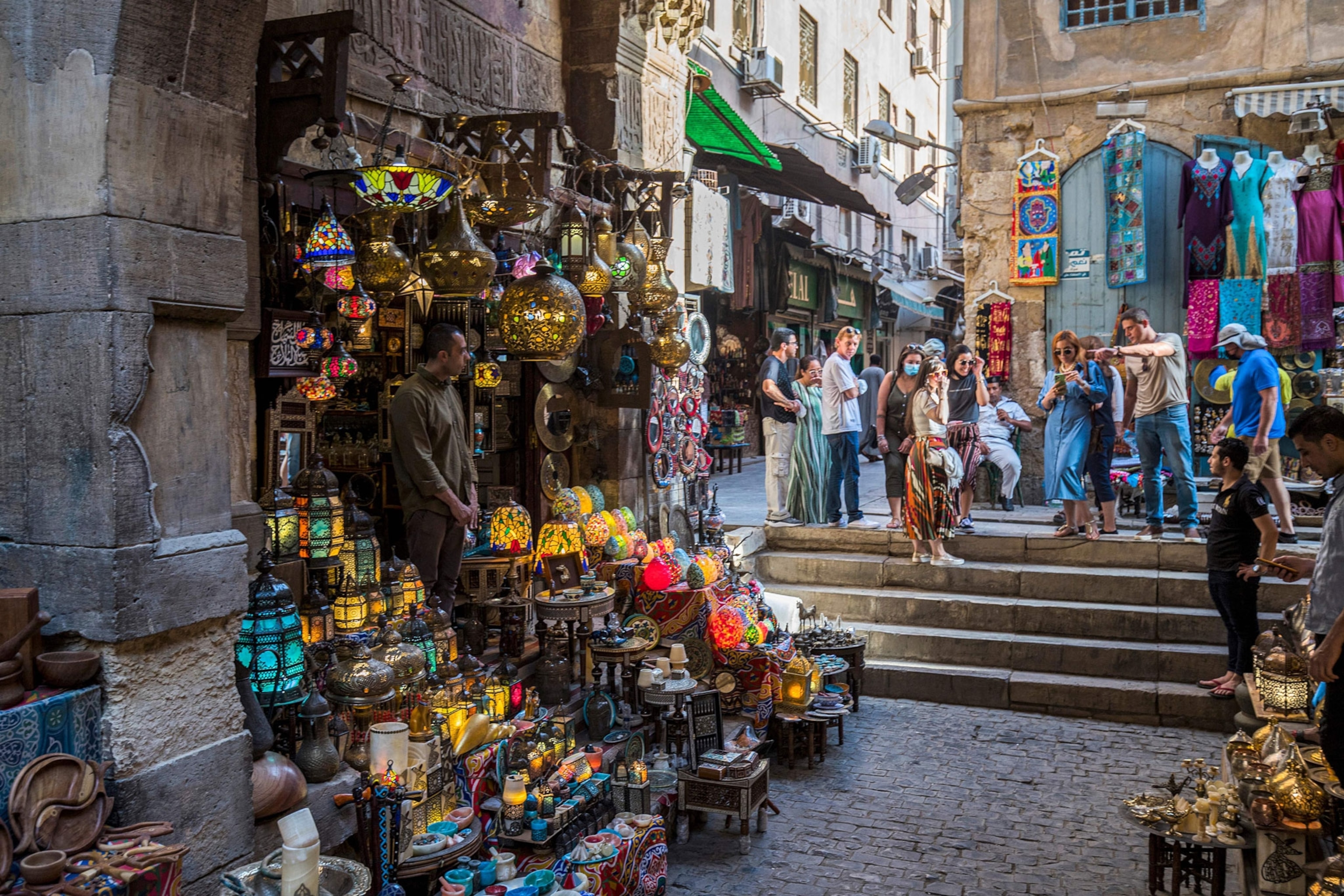 a market selling copper and stained-glass lamps to tourist in egypt